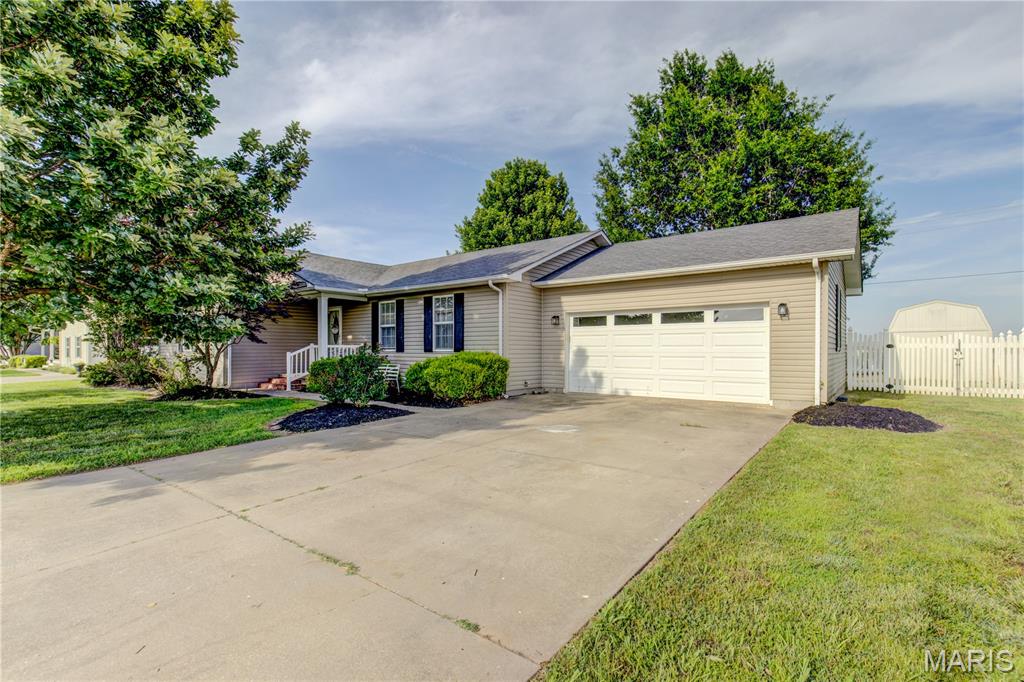 Looking for your first home!?  Check this out!!!  This beautiful 3 bed 2 bath home is a newer home in an excellent location!!!  You are in town but have that fell of the country with fields in front of you and behind you!  So peaceful!!! This home has a such a great layout and some great big ticket items with in!  Large spacious living room with vaulted ceilings definitely  lets you entertain family and friends easily!  Large kitchen with beautiful cabinets, lots of counter top space, and large eat in dining!  The laundry is right off of kitchen for easy convenience as well!  The bedrooms and bathrooms are all on one side of the home!  All big with big closets and beautiful flooring!!!  The backyard is also completely fenced in with vinyl privacy fence, patio area, and an outbuilding!!!  Call and schedule your showing today!!