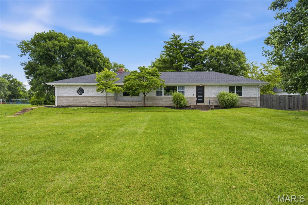 Welcome home to 504 Wren Avenue in Manchester, MO, where everything you never knew you needed is right at your fingertips.

This beautifully updated 2,200 sq. ft. home sits on over half an acre and delivers comfort, style, and function from the moment you walk in. Enjoy wide LVP flooring throughout, elegant Wilson lighting throughout the home, fresh landscaping, a private fenced yard, brand-new garage door, new roof, and a new A/C unit for added peace of mind.

The main level features a stunning fireplace wall wrapped in distressed shiplap, main floor laundry with washer and dryer included, stainless steel appliances, quartz countertops, bar seating, and a large window overlooking the incredible front yard.

The finished lower level offers brand-new carpet, a custom built fireplace, and a spacious media room perfect for movie nights, entertaining, or simply unwinding at home.

The primary en suite feels like a private retreat with a walk-in closet, marble flooring, porcelain shower tile, and a frameless glass shower door.

Located just minutes from restaurants, shopping, parks, major transit access, and top-rated schools, this home combines everyday convenience with elevated living.

With two-panel doors throughout and thoughtful updates in every corner, 504 Wren Avenue is the one that feels like home the second you arrive.