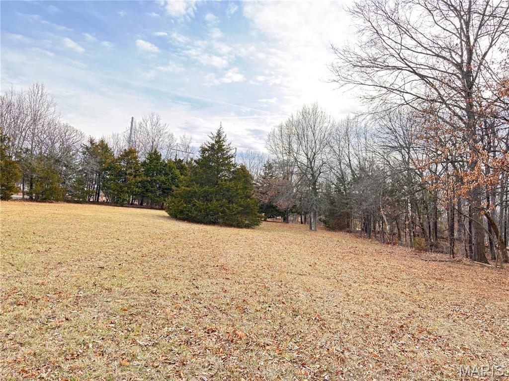 FORISTELL EXIT....BLACKTOP FRONTAGE, NO HOA'S, FEW RESTRICTIONS!!!! 6+/- acres fronting on Hwy O!  Shouses and Barndominiums allowed!  Level to gently rolling acreage with some clearing and some woods perfect for your new home. Property can be divided.  See MLS #26009005 for the 3 acre division.