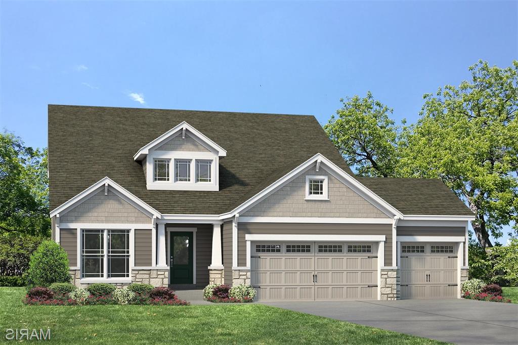 Amazing, 1.5 story home by Fischer and Frichtel in their newest neighborhood, The Villages at Post Farms!  Let new construction simplify your home search and check all the boxes for your real estate needs.  Be the first owner of this dynamic 4 bedroom, 2.5 bath, 1.5 story home with a main floor Primary Suite, 2,614 sq ft of open living space and a 3 car garage.  Features include 9 foot ceilings on the first floor, 2 story Entry and Great Room, luxury vinyl plank flooring throughout the main floor, Flex Room/Dining Room, main floor Laundry, electric Fireplace, 2 panel doors, 5.25 inch baseboards, 42 inch shaker style cabinets with crown, floating shelves, large island, soft close, roll out trays, pull out trashcans, quartz countertops, tile backsplash, undercabinet lighting, walk in pantry, stainless steel appliances, gas range with chimney style hood, drawer microwave, refrigerator, window wall in the Primary Suite, walk in closet, cultured marble shower with bench seat, raised height dual vanities, transom window, 3 secondary bedrooms on the second floor, a Loft, raised height vanity in the guest bath, HVAC zoned damper system and a 12x12 composite deck with steps to a 16x12 patio.  There is an egress window and a rough-in bath in the lower level for an easy future finish if desired.  The curb appeal is impressive with stone, shake accent siding, prairie grills in the windows, architectural shingles, dormer window, carriage style garage door, full sod, landscape and lawn irrigation. Students will attend desirable Wentzville schools.  This home is under construction and scheduled for a September 2026 completion.