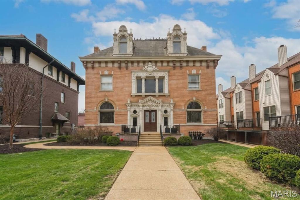 This stately mansion, built in 1896, offers more than 8,000 sq/ft for living, business--or both! The building is currently used for offices but the 7BR/5Ba could house a large family and possibly convert the third floor into a 3BR apartment. Special features include a beautiful covered porch off dining area; enormous open foyer with fireplace; ADA wheelchair lift next to parking in back. Space for 2 cars in garage, and 6 on paved part of lot.  Easy walk to shops and restaurants!! Great CWE location.