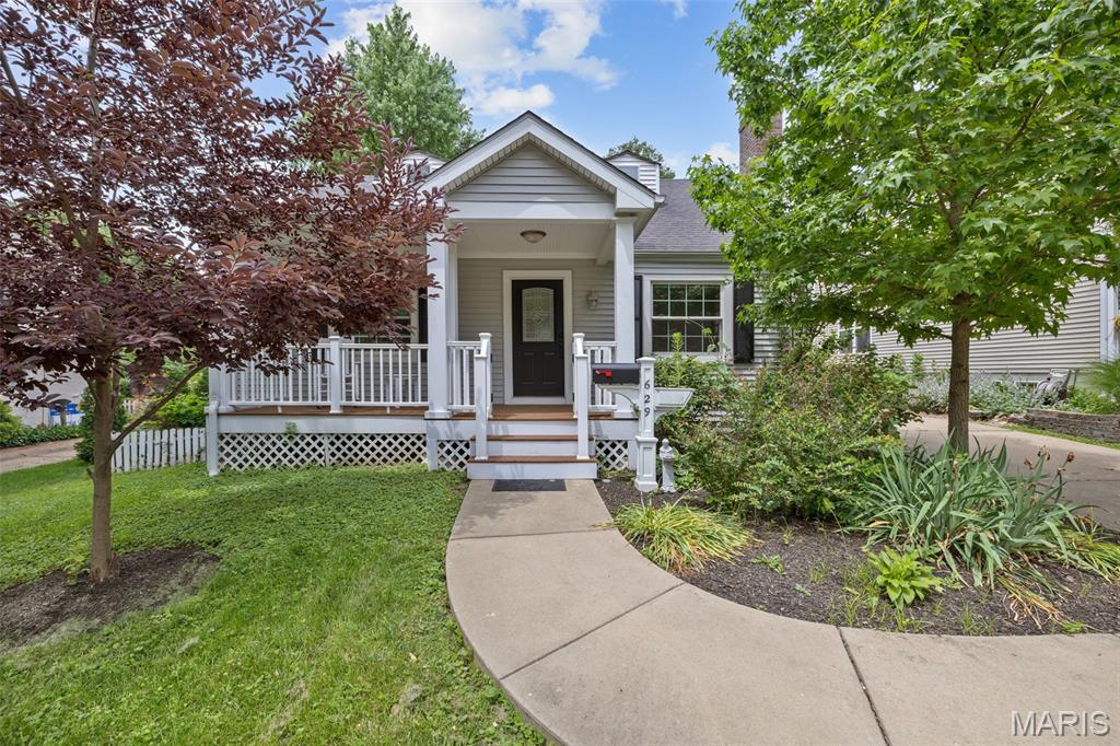 Price Adjustment on this great 4 bedroom in desirable Kirkwood location!  This story and a half home welcomes you with a lovely front porch.  Inside, the living room with wood-burning fireplace will be where you will want to hang out.  Kitchen opens up to the dining area for easy entertaining.  Off the dining room is a very large glass enclosed porch with a newer composite deck attached to overlook the lovely fenced back yard.  Also on the main floor are two bedrooms and a full bath.  Upstairs are two more bedrooms and another full bath.  Outside is an out-building for the hobbyist and their imagination! This is your chance to reimagine a home with enduring bones. Hardwood floors recently sanded and treated.  All rooms have a fresh coat of paint. Crafted in 1947, this residence holds the promise of a fulfilling homeowner experience. Within walking distance to award-winning Kirkwood schools. Close to Kirkwood park and pool, Downtown Kirkwood with all the restaurants, shops, Farmer's market, Performing Arts Center, and more! Check it out today!