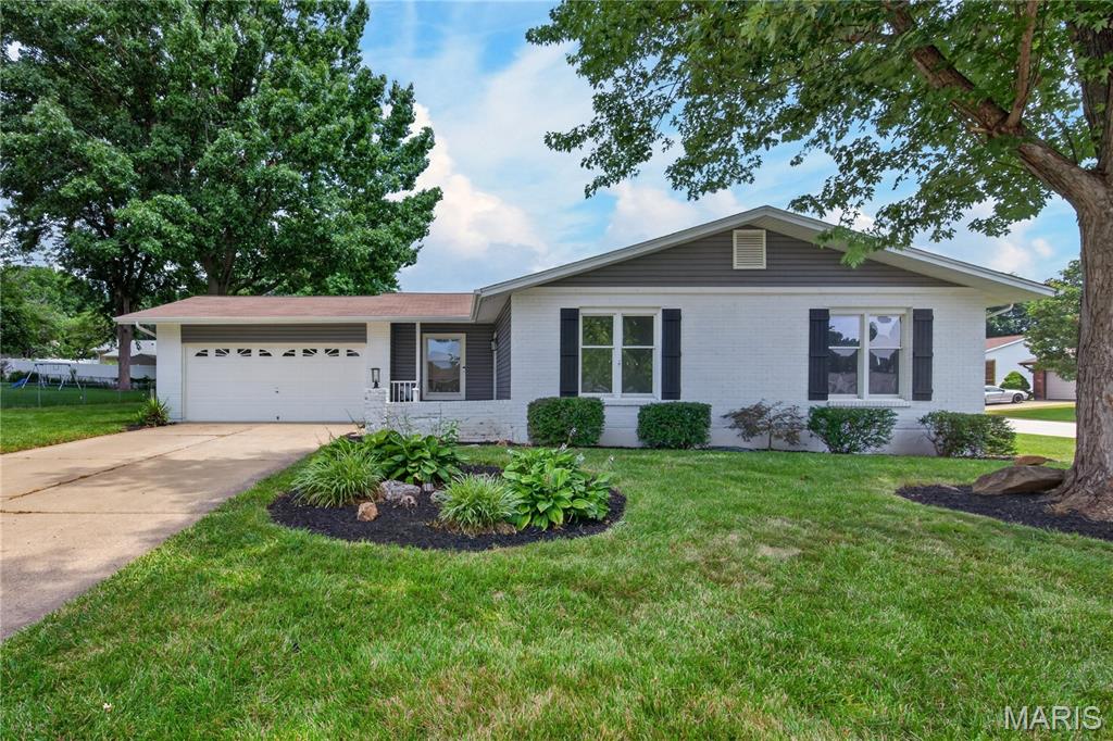 Updated 4 Bedroom, 2 Bath Ranch in a fantastic St. Charles location!  Buyers will enjoy 1,626 sq ft of beautifully finished living space. This home sits on a corner lot and offers excellent curb appeal with a predominantly brick front elevation, low maintenance vinyl siding, enclosed fascia-soffits and an oversized two car garage (23’7D). The Kitchen and both bathrooms are updated in complimentary finishes, providing a nice flow throughout. This home offers a front living room, dining room, family room with corner wood burning fireplace, luxury vinyl plank flooring, on-trend updated kitchen with 36 in white shaker cabinets with crown molding, contrasting lower cabinets, quartz countertops, tile backsplash, stainless steel appliances, smooth top electric range and a large farmhouse sink. The primary bedroom suite has two bypass closets and an updated bath with custom tile shower. The hall bath is in corresponding colors and has a tub/shower with custom tile surround. This home offers a large main floor Laundry Room (Bedroom 4) as well as washer/ dryer hookups in the lower level. The Laundry Room was originally a bedroom and can easily be converted back if desired. There is a garage service door to the backyard and a deck off the family room. The sump pump and garage door opener are new (2026).  During their ownership (11 years), the sellers have updated the kitchen, bathrooms, lighting, siding, HVAC and more. Excellent location near the restaurants, shopping, services and recreation on Mid Rivers Mall Drive and Hwy 94/364.  There is easy access to Highways 94 and 364.  Students will attend desirable Francis Howell Central schools.  Great home, make it yours!