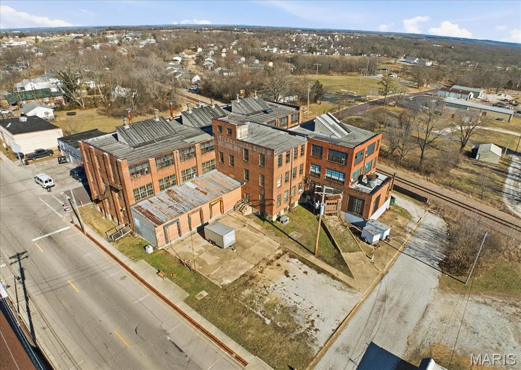 A rare opportunity to reimagine a 39,000 SF historic commercial landmark—formerly the Old Shoe Factory—offering exceptional upside and architectural character you simply can’t replicate today. Rich in history and scale, this iconic building features truck dock access, expansive interior spaces, and solid bones that create an outstanding foundation for transformation. While the property is in need of modernization, it presents a compelling canvas for adaptive reuse, redevelopment, or industrial conversion. Ideal for investors or end-users seeking a high-impact project, the flexibility of the layout lends itself to a wide range of potential uses, including industrial, warehouse, creative, or mixed-use concepts. Step into the next chapter of this historic asset and unlock its full potential.  Building is in need of repairs and some TLC!