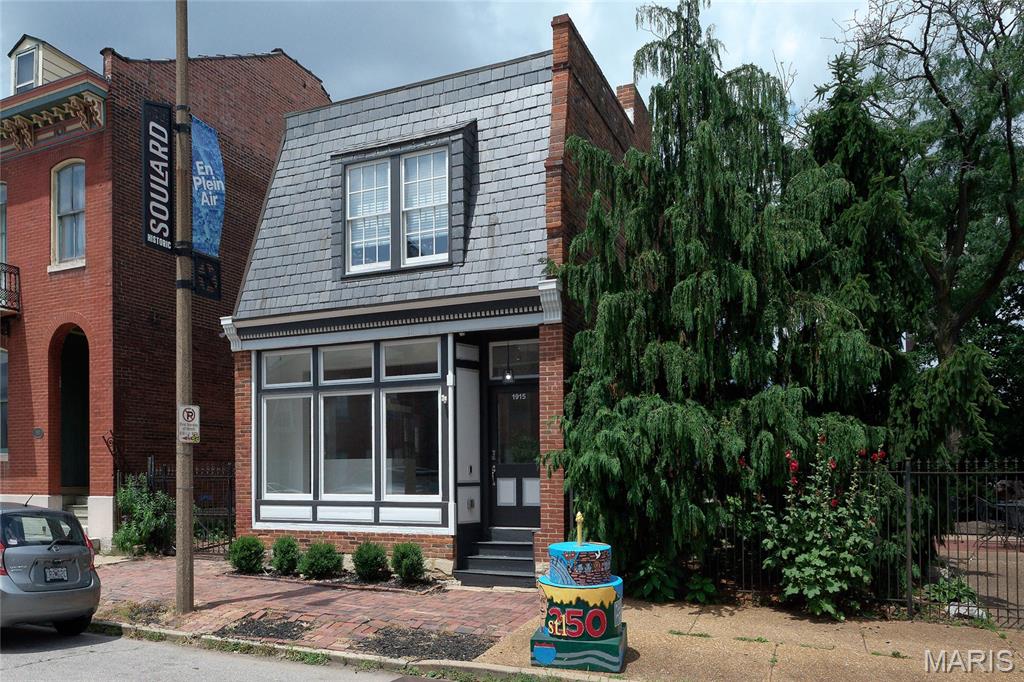 Live, Work & Play—this one-of-a-kind in  Soulard property truly has it all! The second level features a beautifully updated 2-bedroom, 1-bath apartment & private laundry with its own front entrance, making it ideal for owner occupancy or rental income. The stunning kitchen is appointed with quartz countertops, stainless steel appliances, recessed lighting, and creamy white cabinetry, creating a bright and inviting modern living space.  The main level is perfectly suited for a business, studio, showroom, or creative workspace. It offers an expansive showroom with a dramatic front display window, private offices, a stylish kitchenette, original gleaming hardwood floors, and a convenient half bath. A garage provides coveted off-street parking for two or more, while the adjoining patio creates the perfect setting for entertaining clients, friends, or family.  
Whether you're an entrepreneur looking to live where you work, an investor seeking income potential, or someone who appreciates the flexibility of a mixed-use property, this rare opportunity offers endless possibilities in one exceptional package
Experience the best of Soulard living! This vibrant, walkable neighborhood offers an incredible lifestyle with an array of restaurants, neighborhood bars, coffee shops, and beautiful community parks just steps from your door. Enjoy the convenience of the iconic Anheuser-Busch Brewery just a few blocks away, or take your four-legged companion to the nearby Frenchtown Dog Park (primary off-leash park). Whether you're meeting friends for dinner, strolling the historic streets, or exploring all Soulard has to offer, you'll love calling this neighborhood home.