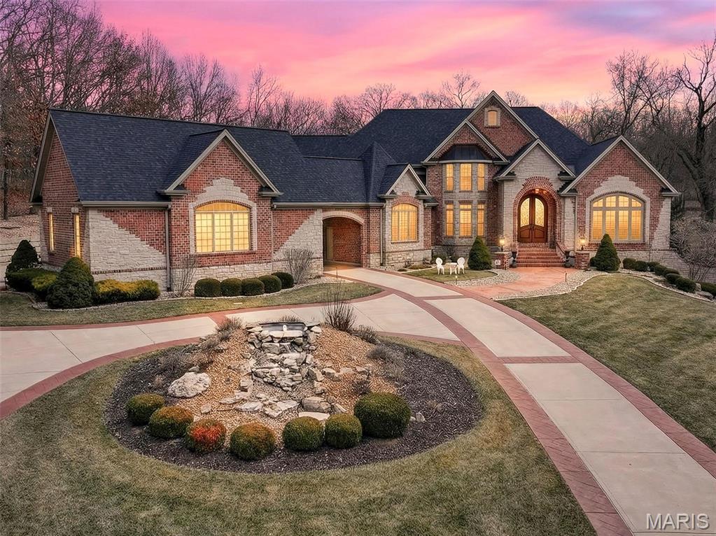 Exceptional elegance on over 3 acres of private paradise! This home is simply majestic! Words don't do it justice. From the Travertine floors to the 4 fireplaces... this home invites you in & makes you want to stay!  The kitchen is a "cooks" kitchen with a Subzero fridge & a Wolf gas range! Lots of cabinets & countertop space to spread out, cook & entertain!  The LL is simply awesome with a magnificent wet bar, custom wine cellar, and a home theater that will make you think you are "at the movies"!! Outside you will find fantastic stone retaining walls that look like "giants" built them! The attention to detail in the stamped concrete accents to the thoughtful landscaping & the stunning front door... it is evident in all aspects of this home! Once you come in, you don't want to leave!  The office/den is full of beautiful woodwork and trim... old school elegance! Something to be proud of for sure! The main floor primary bedroom is everything you could want! oh yeah... a 5-car garage! Additional Rooms: Wine Cellar