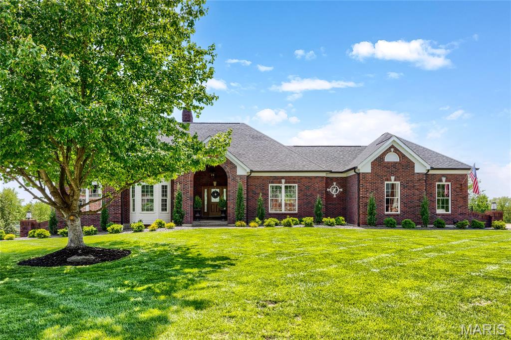 Spectacular brick atrium ranch in beautiful Camelot. This Whittaker-built home features exceptional craftsmanship & distinctive design elements including handscraped hardwoods, soaring ceilings, plantation shutters & expansive windows that offer continuous vista views throughout the home’s interior. Vaulted porch entrance with custom front door with leaded glass panel leads to impressive foyer, formal dining room with detailed trim work, private study and stunning great room with cathedral ceiling & marble fireplace. Designer kitchen with granite countertops, 42” buff cabinetry, KitchenAid appliances & 9’ center island adjoins light-filled breakfast room with groin vault ceiling & atrium door that opens to deck. Primary bedroom suite with wide bay window, customized walk-in closet & spa-inspired bath provides an appealing retreat. A secondary bedroom & hall full bath complete the main floor living quarters. Broad atrium staircase accesses Lower Level entertainment space with recreation room with floor-to-ceiling fireplace, game room & dining area with wet bar plus 3rd & 4th bedrooms & 2 full baths. Situated on a premium 1-acre lot with pool, deck, covered & open patios & 3-car garage.