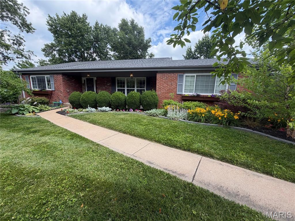 Completely updated and truly move-in ready, this home welcomes you with new landscaping refresh leading to a charming front porch. 

Inside, gorgeous hardwood floors flow throughout. Beautiful built-in shelves anchor the living space and offer clever hidden access behind them to keep all your media tucked neatly out of sight. 

The kitchen shines with nearly-new appliances and opens to an inviting eat-in area - perfect for everyday meals and entertaining alike.

Step out to the covered deck and enjoy everything from crisp spring mornings to warm summer nights to beautiful fall evenings. Upstairs you'll find three generously sized bedrooms and two full bathrooms. 

The finished walkout lower level is ready to become your dream recreation or media room, with plenty of storage to spare. Outside, the fully fenced backyard offers privacy and room to play. 

A rare combination of fresh updates and thoughtful design, this one won't last long!