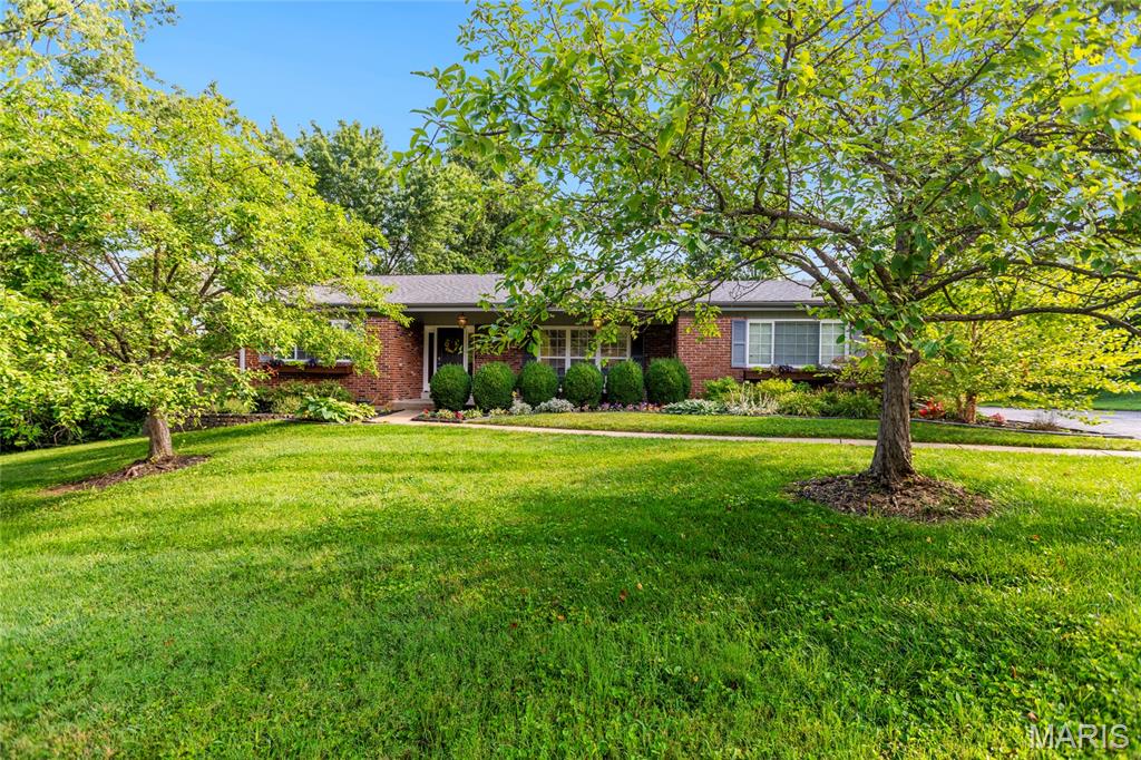 Completely updated and truly move-in ready, this home welcomes you with new landscaping refresh leading to a charming front porch. 

Inside, gorgeous hardwood floors flow throughout. Beautiful built-in shelves anchor the living space and offer clever hidden access behind them to keep all your media tucked neatly out of sight. 

The kitchen shines with nearly-new appliances and opens to an inviting eat-in area - perfect for everyday meals and entertaining alike.

Step out to the covered deck and enjoy everything from crisp spring mornings to warm summer nights to beautiful fall evenings. Upstairs you'll find three generously sized bedrooms and two full bathrooms. 

The finished walkout lower level is ready to become your dream recreation or media room, with plenty of storage to spare. Outside, the fully fenced backyard offers privacy and room to play. 

A rare combination of fresh updates and thoughtful design, this one won't last long!