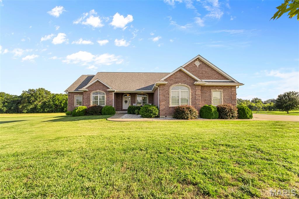 Welcome to refined country living in the heart of Farmington. Positioned on a scenic 3-acre corner lot in the prestigious Stone Creek subdivision, this stunning 4-bedroom, 3.5-bath residence offers the space, privacy, and upscale lifestyle you've been searching for.

From the beautifully maintained grounds to the resort-style pool complete with an automatic cover, every detail has been designed for comfort and convenience. The covered patio and elevated deck create an inviting outdoor living space overlooking the expansive property—perfect for hosting gatherings or enjoying quiet mornings surrounded by nature.

Inside, you'll appreciate the generous floor plan, an attached 2-car garage, and the incredible potential of the spacious walk-out basement. With abundant natural light and direct access to the backyard, this open space offers endless possibilities for additional living areas, recreation, a home theater, gym, or custom finishing to suit your needs.

Combining acreage, luxury amenities, and one of Farmington's most coveted locations, this property truly stands apart. Rarely does a home offer this much space, privacy, and potential in such a desirable setting.

For added peace of mind and value, a brand-new roof, siding, and windows will be completed prior to closing, allowing the next owner to enjoy significant exterior updates from day one.