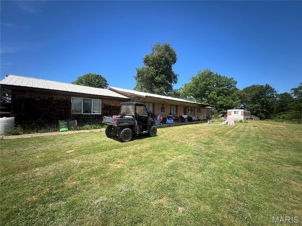 Country Living With Multi-Generational Potential on 6 Acres
Bring your horses, start your garden, and enjoy peaceful country living with this versatile 6-acre property, fenced and cross-fenced pasture, and direct access from paved state highway A. The home offers approximately 1,828 square feet with 4 bedrooms and 1.5 baths. Inside, you’ll find a spacious family room, separate laundry room, central heat and air, and a durable 50-year metal roof. Major updates include an air conditioner that is only 6 years old and a well pump and holding tank replaced just 2 years ago.  Outside, the acreage is already set up for country life with fenced pasture, a horse(not included) already enjoying the pasture, and garden area.  Convenient paved highway access makes commuting easy while still enjoying rural privacy.