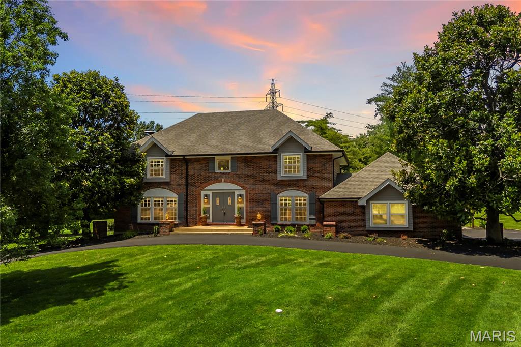 Open Sun, 7/5, 12-2pm. Nestled on a premier corner lot of nearly 2/3 acre and backing to more than 6 acres of common ground, this exceptional residence offers a rare blend of luxury, privacy, and timeless appeal. Thoughtfully updated throughout, the home showcases sophisticated living spaces designed for both everyday comfort and elegant entertaining.

At the heart of the home, the extensively renovated kitchen boasts quality finishes and seamless flow into the inviting family room, where a gas fireplace creates a warm and welcoming atmosphere. French doors open to extraordinary outdoor living spaces highlighted by a screened porch and an expansive composite deck with aluminum railings. The hot tub, included with the home, provides the perfect place to relax while enjoying peaceful views of the surrounding common ground.

The upper level features four spacious bedrooms, including a stunning primary retreat complete with a woodburning fireplace, walk-in closet, and private en suite bath. The hall bath is beautifully appointed with a separate jetted soaking tub and shower. For added convenience, multiple options exist for relocating the laundry to the second floor.

Extensive improvements ensure both beauty and peace of mind, including a new dishwasher (2026), refrigerator (2025), composite decking and aluminum railings (2025), carpet (2024), lower-level zone furnace and A/C (2021), kitchen renovation (2019), tile shower (2019), tile flooring (2019), windows (2019), French doors (2019), impact- and wind-resistant 30-year roof (2018), and asphalt driveway (2016).

Ideally located within the award-winning Parkway School District, this meticulously maintained home offers an exceptional lifestyle in one of West County's most sought-after settings.
