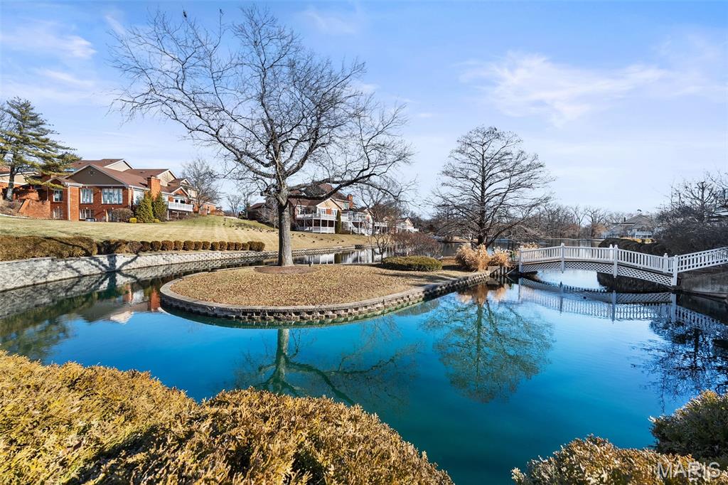 Designed for those who value freedom as much as space. Lakeview villa offers a refined lock-and-leave lifestyle inside a private gated community. Outdoor maintenance is included in the association fee. One of the largest villas, over 6,000 sq ft of living area. Finished walk-out lower level, ideal for hosting family, guests, or extended stays between travels. Kitchen anchors the home w/ a center island & breakfast area that opens naturally to everyday living. Sweeping staircase creates a sense of arrival, while the formal living room& two-sided fireplace flow into a sunroom w/ lake views & direct access to the deck. 1st floor primary suite supports easy living, w/generous secondary bedrooms & a second-floor family room offering flexibility for visitors or work-from-home needs. Finished lower level adds recreation space, a two-sided gas fireplace, & walk-out access to the lake setting. Oversized attached 2-car garage. A sophisticated retreat for those who prefer experiences over upkeep.