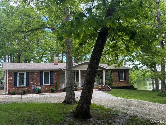 Charming 3-bedroom, 2-bath ranch home on 1 acre with serene lake access awaits its new owner. Featuring a walkout basement, this property offers endless potential for entertaining and enjoying the outdoors. Nestled in unincorporated St. Charles County within the sought-after Wentzville School District, it provides the perfect blend of peaceful living and convenient access to area amenities. Please note, a new septic system will need to be installed by the new owner. Showings are available this Friday, Saturday, and Sunday—don’t miss your chance to make this lakeside retreat your own! 
New roof April 2024 by John Beal Roof. New Well Pump '2025