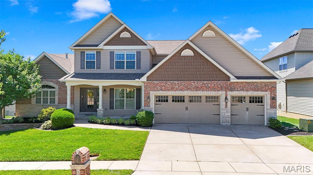 Welcome to this IMPRESSIVE 1.5-Story home in sought-after Leighton Hollow!! This 5-bedroom, 4.5 bath residence combines spacious living with exceptional design. The main-floor primary suite features a luxourious bath with double vanity, soaking tub, separate shower, and walk in closet. The heart of the home is the chef-inspired kitchen complete with a huge quartz center island, custom cabinetry, quartz countertops, large walk-in pantry, breakfast bar, and adjoining breakfast room. The open floor plan showcases a dramatic great room with soaring ceilings, fireplace, and abundant natural light. Additional  main level features include a formal dining room, and rich hardwood flooring. Upstairs, you'll find three generously sized bedrooms, two full baths, Jack and Jill bathrooms, and a spacious recreation room perfect for a media area, or home office. The professionally finished walk-out lower level expands the home's living space with an impressive open-concept design featuring luxury vinyl plank flooring, recessed lighting, and abundant natural light. Entertain with ease in the spacious recreation area complete with a custom wet bar showcasing rich cabinetry, solid surface countertops, beverage refrigertors, and ample serving space. A beautifully updated full bath offers designer finishes including a modern vanity, custom tile shower, and stylish black fixtures. The expansive layout provides endless flexibility for a media room, game room, fitness area, home office, or guest accommodations, while direct walk-out access seamlessly connects indoor and outdoor living. Situated on a desirable fenced in lot in the Francis Howell School District and featuring an oversized 3-car side entry garage, this home offers the perfect blend of comfort, style, and functionality. HVAC (2022) Water Heater (2022) Roof (2022)