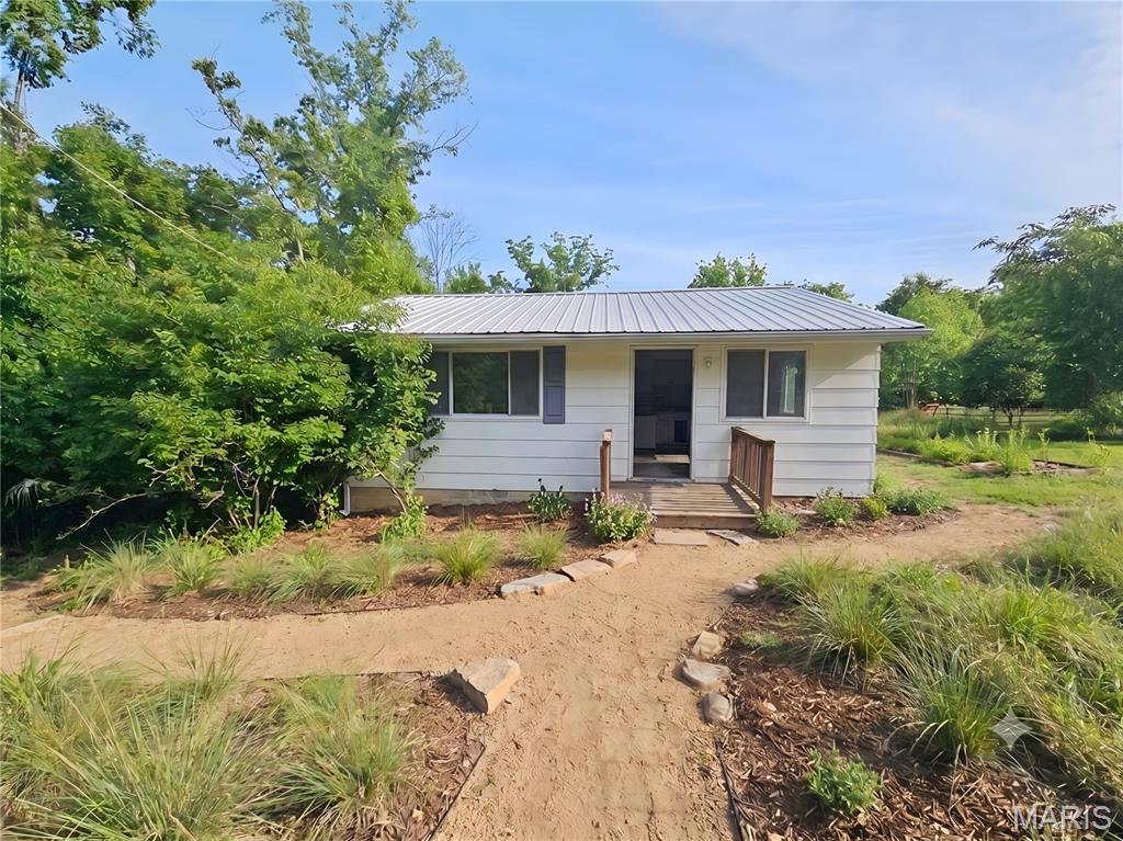 Charming and efficiently designed, this 2-bedroom, 1-bathroom home in House Springs offers approximately 572 square feet of cozy living space, complemented by a comfortable living room and a partially finished basement for added flexibility. Situated on a generous 0.46-acre lot, the property features plenty of outdoor space to enjoy alongside the convenience of dedicated off-street parking. Perfect for anyone seeking a manageable layout with room to grow, this home combines practical indoor living with an expansive yard.