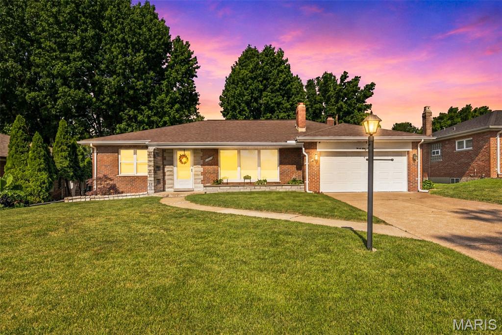 Welcome home to this beautifully updated 2-bedroom, 2-bath ranch nestled in a prime South County location near Affton. From the charming brick exterior to the long list of modern updates, this home offers the perfect blend of style, comfort, and efficiency. Step inside to a spacious living room filled with natural light from newer windows, complemented by fresh neutral paint and a cozy fireplace that creates the perfect gathering space. The inviting eat-in kitchen features stylish countertops, updated cabinetry, stainless steel appliances, and plenty of room for everyday dining. Both bedrooms showcase beautiful hardwood floors and generous closet space, while the updated hall bath offers a fresh, contemporary feel. The bright and airy family room is a true highlight, featuring a second fireplace and direct access to the backyard oasis. Outside, you'll love relaxing under the stunning pergola-covered patio overlooking the partially fenced, level backyard filled with colorful landscaping and a meticulously maintained lawn, making it an ideal setting for entertaining or peaceful evenings at home. Energy-conscious buyers will appreciate the rooftop solar panels and the home's electric vehicle charging capability. The finished lower level provides exceptional additional living space with a large recreation room, two versatile bonus rooms perfect for a home office, gym, or guest space, a second full bathroom, plus a spacious unfinished storage and laundry area. Located in the highly acclaimed Lindbergh School District and just minutes from Grant's Farm, Grant's Trail, Whitecliff Park, shopping, dining, and major highways, this home truly has it all. Extensive updates completed since 2019 include the HVAC system, windows, doors, appliances, blinds, solar panels, pergola, and more. This is one of those homes that feels even better in person. Schedule your showing today!