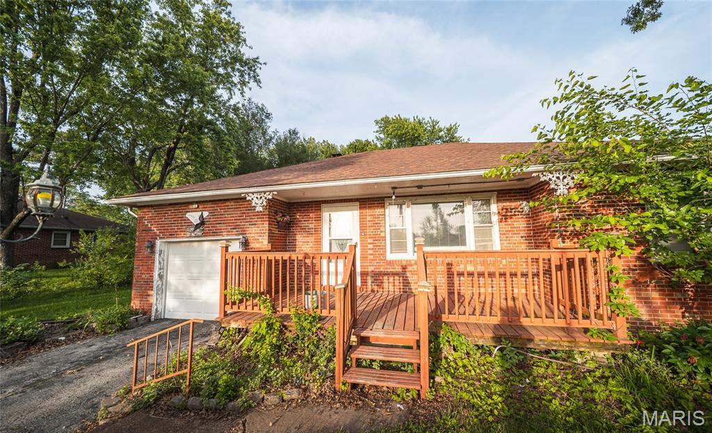 Situated on a large lot with an incredible shaded backyard, this spacious 2-bedroom, 1-bath home offers comfort, functionality, and plenty of room to enjoy both inside and out. The open floor plan creates a welcoming feel with generous living space throughout. There are two good sized  bedrooms and the closets provide ample room for storage.

The kitchen features abundant oak cabinetry along with a newer dishwasher and refrigerator, offering both charm and convenience. Outdoor spaces are perfect for relaxing or entertaining with a large front porch, concrete back patio, and an additional side deck to enjoy. The full unfinished basement provides excellent storage or potential for future expansion. Schedule your showing today!

**Seller is offering $2,000 credit at closing for flooring.  Home is being sold 'as-is'