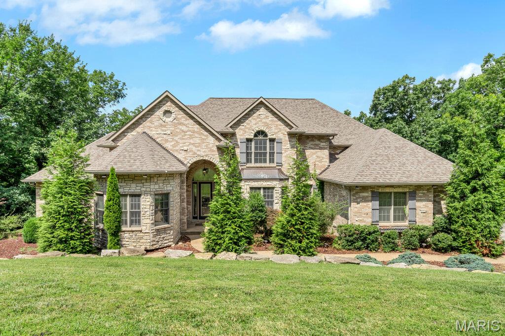 Experience luxury living in this stunning 1.5-story home perfectly situated on a premium golf course lot. From the moment you enter, you'll be captivated by the dramatic two-story great room featuring soaring ceilings, abundant natural light, and breathtaking views. The striking floating staircase creates a true architectural statement and sets the tone for the home's modern elegance.
The spacious floor plan offers exceptional living and entertaining spaces, 4 fireplaces, a huge deck, screened-in deck overlooking the golf course-perfect for enjoying morning coffee or relaxing evenings. The finished lower level is an entertainer's dream, complete with a dedicated theater room, home gym and plenty of additional space for recreation, and gatherings. Combining luxury, comfort, and an unbeatable golf course setting, this exceptional home offers the lifestyle you've been waiting for. Don't miss your opportunity to own one of the area's most impressive properties!  Roof was just replaced and upgraded to a Class IV shingles!