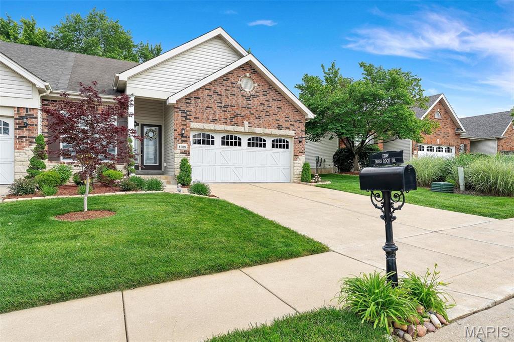 Tucked away in a quiet St. Charles community, this beautifully maintained and updated condo is a MUST SEE! Before entering the front door, you are greeted by a lush green lawn with beautifully updated landscaping. From the moment you step inside the foyer and into the large dining/gathering area with 9' ceilings, recessed lighting, and beautiful hardwood flooring that all continue throughout the home, you know this place is special. The open kitchen is designed for everyday living and entertaining, featuring stainless steel appliances, updated cabinetry, mosaic tile backsplash, and a bay breakfast area that opens to a private backyard retreat. The backyard presents a park-like atmosphere including a boulder wall and manicured landscaping where you can enjoy your morning coffee or afternoon barbeque. The well-designed lower level offers a recreation area, living space, kitchenette with eating area, and a bonus room. Let’s not forget the spa-like large bathroom with a soaker tub, shower, blue tooth speaker, and high-end tile on the floor and walls. Not only is this home turn-key ready, a new Class IV high impact roof with pivot boots, as well as a new A/C unit, all installed in 2026, give you peace of mind for years to come! 1708 Moss Rock Drive is a rare opportunity and will not last long.