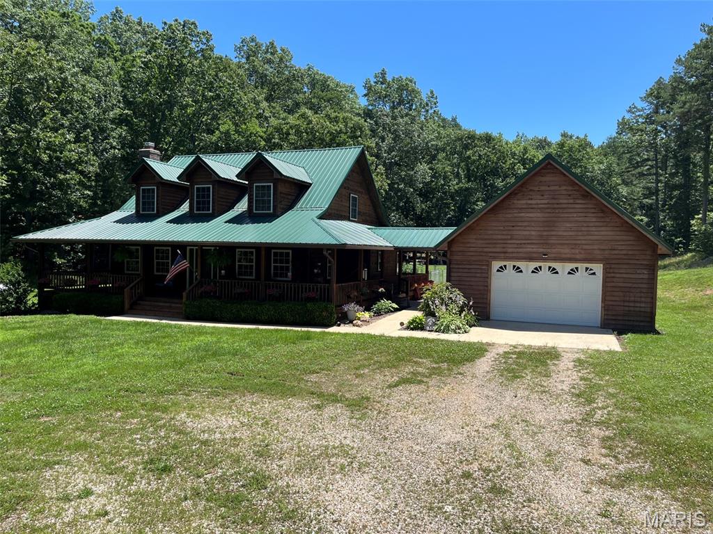 Discover a home and 24+/- acres designed for modern living at 714 CR 584, Piedmont, MO. The property joins conservation land on one side. Constructed in 2003, this single-family residence offers a harmonious blend of comfort and style, providing an exceptional foundation for your next chapter. Consisting of 3 bedrooms, 2-1/2 baths, and lots of space. Wrap around deck with front and rear sitting areas, back patio, carport, detached garage with a covered breezeway. Whole house automatic Generac generator w/LP tank. A 30' x 54' detached shop building with lean-to's on each side for all your goodies to be under roof, and room for all your hobbies. A smaller pen for poultry or farm animals is in place. Combination of some open acreage with the majority in woods gives you the perfect spot for viewing (or harvesting) the abundant wildlife in the area. This property presents a unique opportunity to embrace a desirable lifestyle. Schedule your personal tour and envision the possibilities.