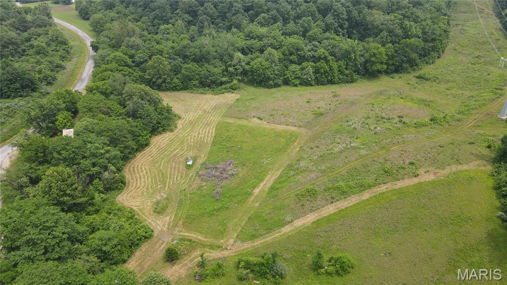 This 43.79± acre property is located off County Road 389 just minutes from Lake Girardeau Conservation Area. The property offers a great combination of timber, wildlife habitat, and open ground. A wet-weather creek winds through the property, providing a water source for wildlife. The property includes some pasture ground, with the majority of the acreage being wooded and well-suited for recreation and hunting.

A timber harvest was completed in 2024, creating excellent wildlife habitat while leaving plenty of quality hardwood trees throughout the tract. An Ameren transmission line runs along the south boundary of the property.

The property features blacktop county road frontage and electric service on-site, although the service is currently disconnected. An older house is located on the property and is being sold as-is with no assigned value. The structure is not considered livable.

Whether you're looking for a hunting property, recreational getaway, investment tract, or future building site, this versatile acreage offers plenty of potential.