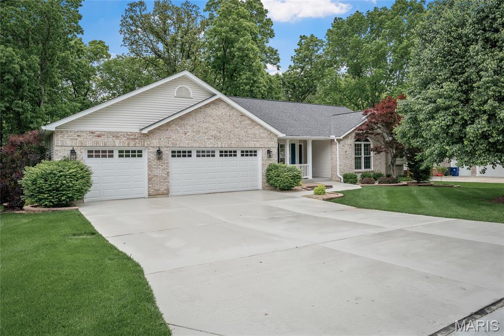 Welcome home to this spacious ranch offering over 1,900 sq ft on the main level, a meticulously finished basement and situated on a beautiful .5-acre lot backing to mature trees for added privacy and peaceful views! Located on a quiet cul-de-sac in Wentzville, this home features a functional open layout with generous living spaces and a desirable 3-car garage with a convenient garage service door that provides direct access to the backyard.
The secondary bedrooms share a convenient Jack & Jill bath, while the main level offers comfortable everyday living and great entertaining space. The finished walkout lower level expands your living area with an additional bedroom, office, full bath, spacious rec/living area, and bar—perfect for guests, entertaining, or working from home.
Step outside to enjoy the private backyard setting with tree-lined views and plenty of room to relax, entertain, or play. This home offers the perfect combination of space, privacy, and versatility in a fantastic location!