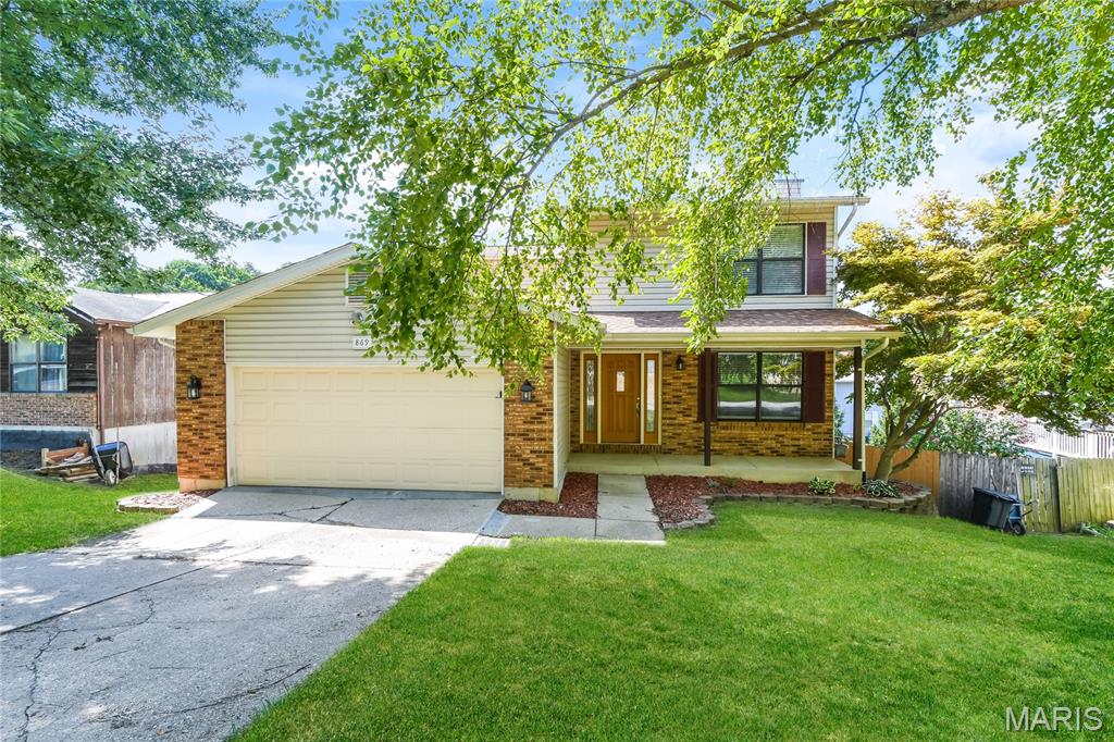 This two-story home offers a covered deck, yard with privacy fence and oversized two car garage. Inside you will find an extra-large living room, crown molding and a wood burning fireplace with blower. It also features a spacious kitchen and breakfast room with large pantry. Upstairs are three bedrooms and two full baths. A partially finished walk out lower level includes a media room and tons of storage.