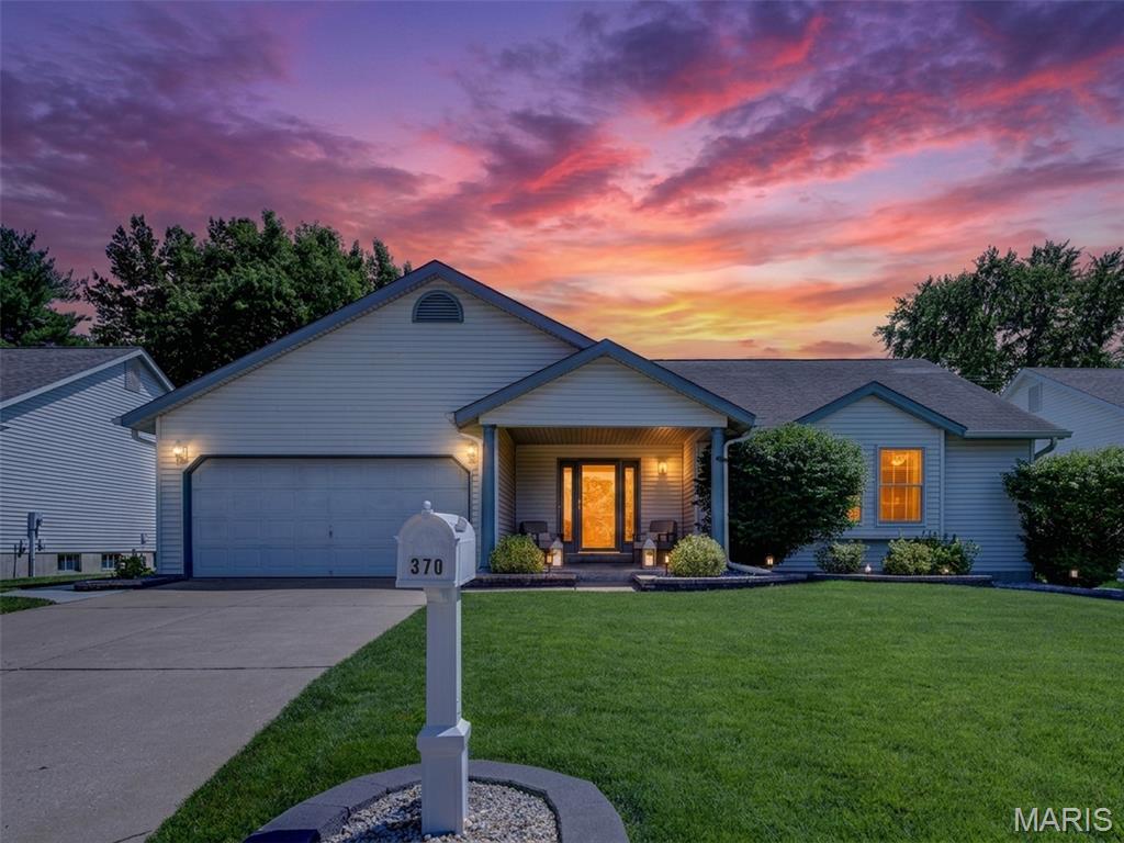 Welcome to 370 Misty Valley Drive in sought-after Misty Valley Estates! Located in the highly acclaimed Ft. Zumwalt East School District and just minutes from shopping, restaurants, hospitals, and major interstates, this beautifully updated ranch offers over 2,661 sq. ft. of finished living space designed for comfortable everyday living and effortless entertaining.

Pride of ownership shines throughout this impeccably maintained 3-bedroom, 3-bath home. The inviting open floor plan features newly installed luxury vinyl plank flooring flowing through the foyer, vaulted great room, hallway, hall bath, and primary bedroom, creating a cohesive and updated look throughout the main level.

The stunning kitchen is the heart of the home, showcasing custom cabinetry with crown molding, soft-close doors and drawers, beautiful quartz countertops, decorative tile backsplash, custom range hood, under-cabinet lighting, deep undermount double sinks, and a large center island with seating. Stainless steel Bosch appliances complete the space, and the refrigerator is included with the sale.

The adjacent breakfast room offers easy access to the backyard through a newer sliding glass door, while the convenient main-floor laundry includes a front-loading washer and gas dryer that will remain with the home.
Retreat to the spacious primary suite featuring an expanded floor plan that enhanced both the bathroom and walk-in closet. The luxurious primary bath has been beautifully updated with a custom dual-sink vanity featuring soft-close doors and drawers, along with elegant quartz countertops extending to the pony wall and deep window ledge.

The hall bath has also been tastefully renovated with a custom vanity, soft-close cabinetry, and quartz countertop, while the finished lower-level full bath continues the same quality finishes with an updated custom vanity and quartz surfaces.

The finished lower level expands your living and entertaining space with a family room, recreation area, sleeping room, full bath, and an incredible custom wet bar featuring quartz countertops, custom cabinetry, seating for five, and a refrigerator that is also included.

Step outside and discover your own backyard oasis. The professionally landscaped, fully fenced yard is highlighted by an expansive 42' x 18' patio, creating the perfect setting for outdoor entertaining, family gatherings, or simply relaxing in your private retreat.

Additional updates include Renewal by Andersen replacement windows, roof, HVAC system, water heater, gutters with Leaf Filter system, insulated front door, sliding glass door, epoxy garage floor, and more. This move-in-ready home offers the rare combination of extensive updates, exceptional care, and an outstanding location.