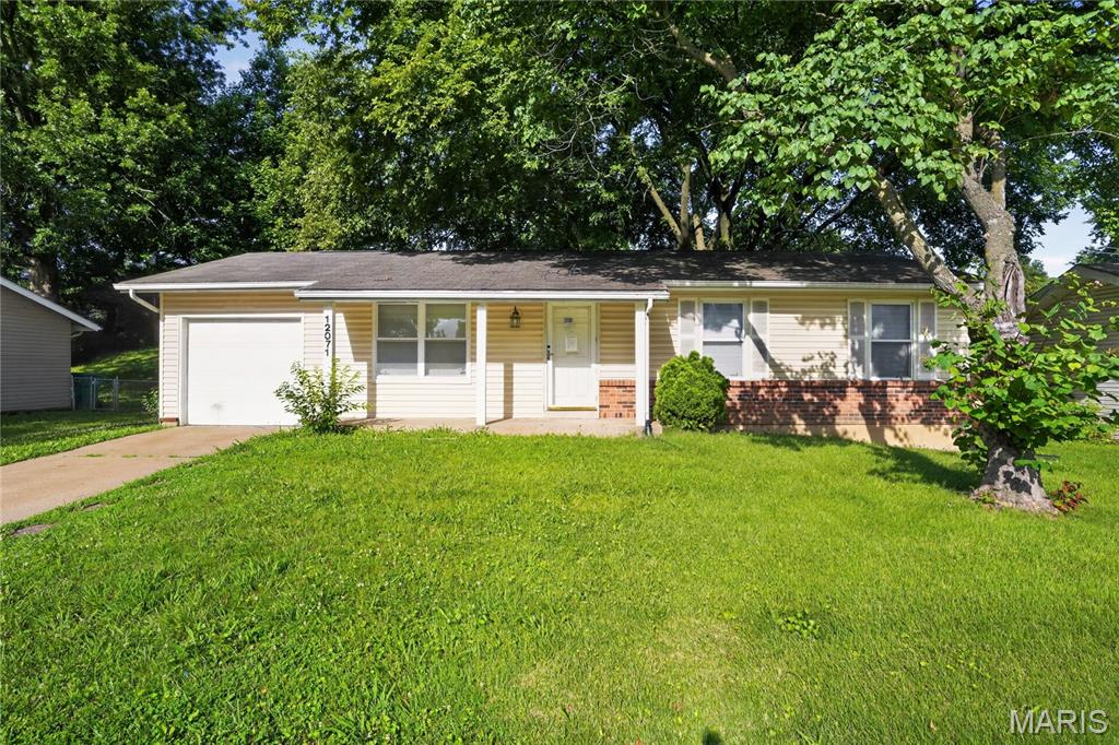 Charming 3-bed, 1.5-bath ranch home in the sought-after Pennyrich Farms community! This solid brick-front residence features a bright, spacious living room with original hardwood floors flowing throughout the main level. The functional eat-in kitchen offers plenty of cabinet space and a sliding glass door leading out to a peaceful concrete patio and level backyard. The primary bedroom features its own private half-bath ensuite. A massive, unfinished lower level provides endless storage or future living space potential. Includes a 1-car attached garage and great subdivision amenities like a pool and tennis courts.