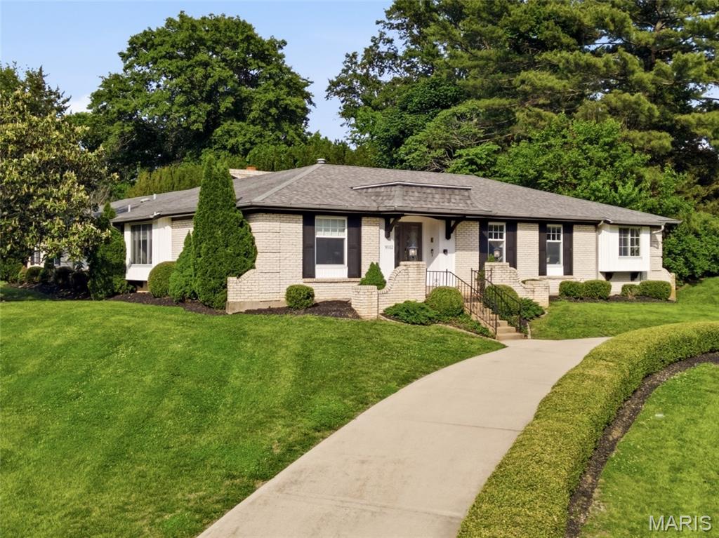 Gorgeous 4-bedroom, 3.5-bath all-brick ranch home with over 4,200 sq ft of living space in the highly sought-after community of Sunset Hills and located within the acclaimed Lindbergh Schools offers the perfect blend of luxury, comfort, and everyday living. From the moment you arrive, the elegant circle drive, mature landscaping, and welcoming presence create a feeling of home. At the heart of the home is an absolutely stunning kitchen that truly sets this property apart from others in the area. Designed for both entertaining and daily life, this beautifully updated space features custom cabinetry, granite countertops, double wall ovens, a pot filler, reverse osmosis drinking water filtration and an oversized island and breakfast bar that becomes the natural gathering place for family and guests. With abundant prep space, exceptional storage, and a layout rarely found in comparable homes, this kitchen offers both beauty and functionality on a level that is hard to match. Rich wood flooring flows throughout the main living areas, adding warmth and sophistication. The vaulted living room with a cozy gas fireplace creates an inviting atmosphere, while the formal dining room, breakfast room, and relaxing sunroom provide thoughtful spaces for every occasion. Primary bedroom suite features his and her closets, access to back patio, updated primary bath which includes dual sink vanity and walk-in luxury shower. You will also find on the main level three additional spacious bedrooms with large closets. The finished lower level offers incredible flexibility with a spacious recreation room, family room, bonus sleeping area (potential 5th bedroom), full bath, office and generous storage. Outside, enjoy your own private retreat featuring a large stamped concrete patio, pergola, fire pit, and beautifully landscaped backyard designed for memorable evenings and effortless entertaining. Additional features include main floor laundry room, entry foyer, attached oversized 2-garage car, easy access to freeways, shopping, dining, parks and entertainment.