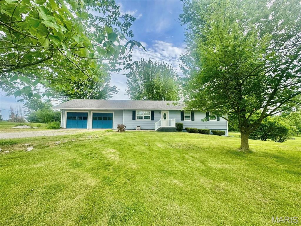 Your own private oasis that won't break the bank! Check out this beautiful 3-bedroom home sitting on a full basement and an acre of ground! If you don't get lost in the perfect sized yard of mature trees and blooming flowers, step inside to find a meticulously cared for home! Once inside you will find a massive eat-in kitchen with a multitude of upgrades and sliding doors that escort you to your back deck to keep watch over the back yard. Further through the house you will find the spacious living room, three bedrooms, and a bathroom with a double vanity that is calling your name! Additional features include an attached 2 car garage, 2 detached sheds in the yard, and a concrete patio for your full walk-out basement. Opportunities with this much to offer don't happen often, so stake your claim today!