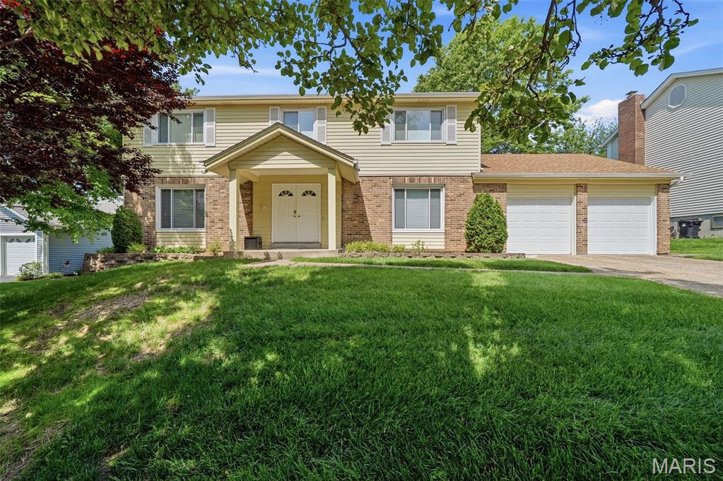 Tucked on a quiet cul-de-sac in Parkway School District, 12067 Mereview offers over 2,200 square feet of inviting living space, plus additional flexible space in the partially finished lower level. A welcoming entry foyer opens to a formal living room currently styled as a home office, alongside a dedicated dining room ideal for entertaining. The heart of the home is the warm and inviting family room, highlighted by a full brick fireplace wall, hardwood floors, and large windows overlooking the backyard. The spacious eat-in kitchen offers ample cabinet storage, views of the fully fenced yard, and direct access to the patio for easy indoor-outdoor living. Main floor laundry and an attached garage add convenience and functionality. Upstairs, the expansive primary suite provides a comfortable retreat, while three additional bedrooms complete the upper level. The partially finished basement offers excellent entertainment space including a bathroom, plus additional unfinished storage space for future possibilities. With its functional layout, timeless character, and desirable location, this home is ready to welcome its next owners.