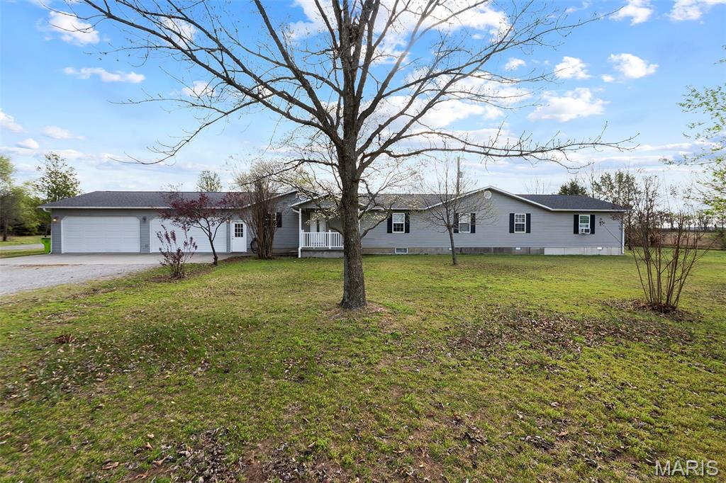 Spacious country living at its finest! Situated on 16.85 acres just outside of Benton, this 6-bedroom, 3-bath home offers 2,576 square feet of versatile living space perfect for a growing family or those who love to entertain. The home features an oversized garage and a functional layout with plenty of room for everyone. Step outside and you’ll find everything you need for work and play, including a large shop complete with RV parking, a half bath, and its own independent septic system—ideal for hobbies, storage, or a home-based business. Enjoy outdoor living with a fully equipped outdoor kitchen, a charming gazebo, and a 24x40 concrete pad ready for gatherings, recreation, or additional building potential. With wide-open acreage and endless possibilities, this property combines privacy, functionality, and comfort all in one. Don’t miss your opportunity to own this one-of-a-kind property!