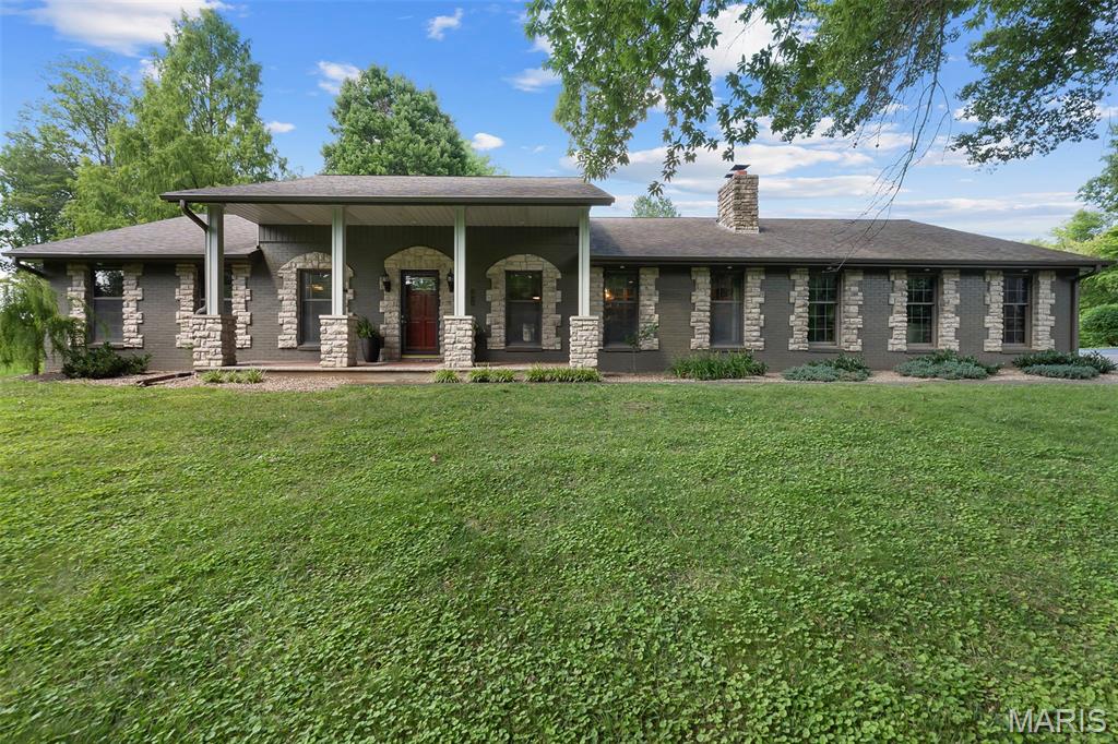 Tucked into one of the most picturesque settings, this property offers a rare blend of natural beauty and convenience. Surrounded by a harmonious mix of mature trees and open space, the home sits on 5.76 acres just minutes from local hospitals, dining, and shopping.
Warm and inviting throughout, the home is designed for both everyday living and entertaining. The main level provides generous space for gatherings, seamlessly connecting to a beautiful covered outdoor living area with a kitchen that is ideal for hosting in any season.
The newly remodeled lower level features three bedrooms, two full baths, a spacious family room, and a full kitchen, creating excellent potential for multi-generational living, guest accommodations, or extended entertaining space.
With its peaceful setting, flexible layout, and abundant indoor and outdoor living areas, this home offers endless possibilities for both formal and informal gatherings in a truly serene environment.