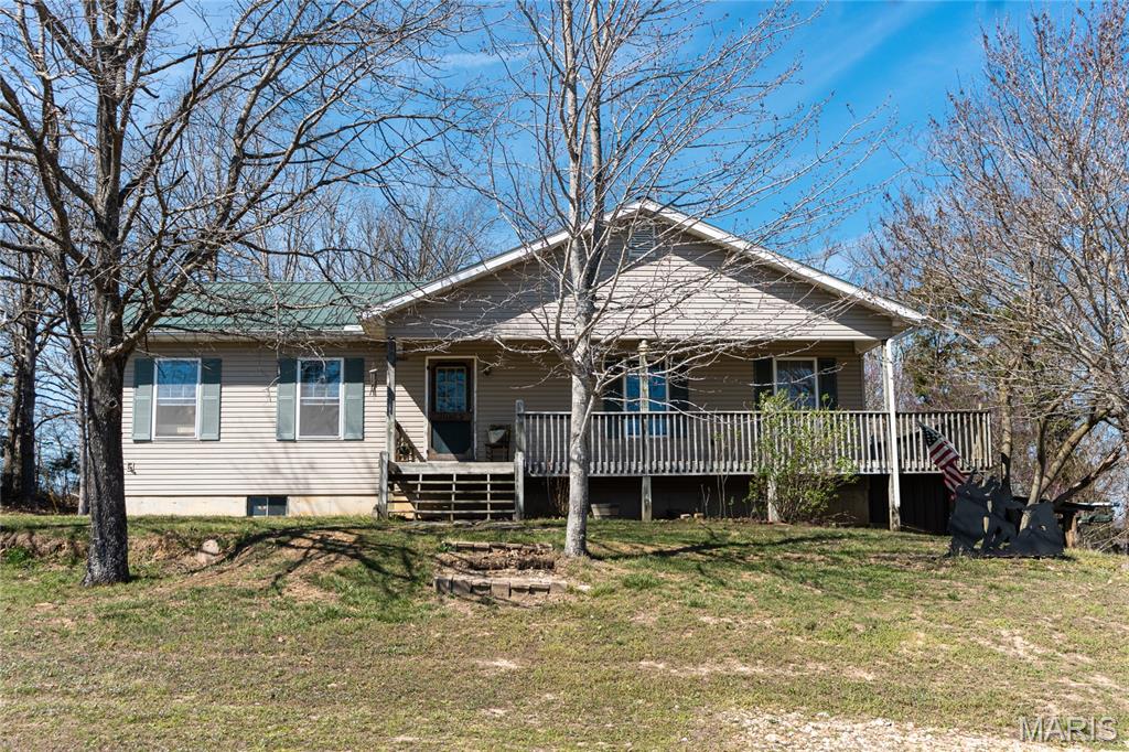 Charming 3-bedroom, 2.5-bath home sitting on just over an acre in a peaceful countryside setting, offering the perfect blend of privacy and comfort. This home features an inviting open floorplan with laminate flooring throughout the main living areas, creating a warm and functional space for everyday living and entertaining.

The main level offers a spacious layout with comfortable living areas and plenty of natural light, while the full finished basement provides even more room to spread out. Downstairs, you’ll find a large family room—perfect for movie nights, gatherings, or a play area—along with additional flexible space to fit your needs.

Enjoy quiet mornings on the covered front porch and unwind in the evenings on the back deck overlooking the property, offering plenty of room for outdoor activities, pets, or simply enjoying the peaceful surroundings.

With over an acre of land, a spacious interior, and a serene country location, this home offers the ideal combination of space, comfort, and lifestyle. Don’t miss your opportunity to make it yours!