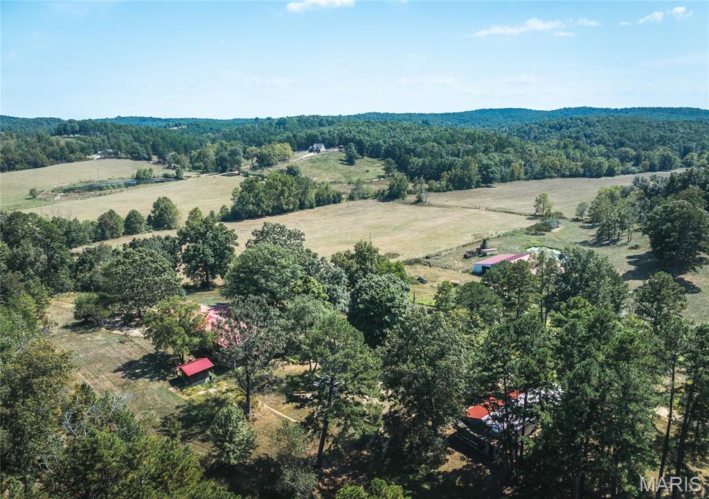 178-Acre Livestock Farm with Home, Springs & Shop – Shannon County, MO
Welcome to your dream farm in the heart of the Missouri Ozarks! This stunning 178-acre livestock-ready property in Shannon County, MO offers the perfect combination of functionality, natural beauty, and rural tranquility.
Nestled among rolling pastures and whistling pine trees, the land boasts multiple year-round springs and a large spring-fed pond, ideal for livestock and wildlife alike. With excellent fencing and high-quality pasture, this property is ready to support cattle, horses, or any livestock operation you envision. 130+/- acres of pasture.
The centerpiece of the property is a spacious 4-bedroom, 3-bathroom home, offering comfortable country living with scenic views of the fertile bottom fields. Whether you’re starting a family farm or looking for a peaceful retreat, this home has room to relax and grow.
Infrastructure includes:
•Large hay barn with stalls and ample storage for equipment and feed
•Three-bay shop with room for tools, vehicles, and workshop space
•Artesian Spring with decorative well, plumbed with spigot 
LOCATION & RECREATION:
Situated just minutes from the charm of Eminence, MO
•Alley Spring & Mill
•Current and Jacks Fork Rivers (famous for floating, fishing & kayaking)
•Mark Twain National Forest
•Echo Bluff State Park
This is more than just a farm – it’s a legacy property with natural water, productive land, and access to Missouri’s most scenic landscapes.