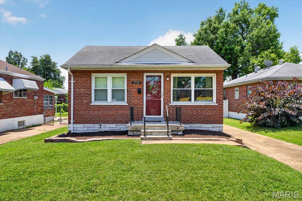 Charming South City home featuring 2 bedrooms, 1 bath, a finished lower level, and an oversized 1-car garage! Step inside to find beautiful wood floors, abundant natural light, and a neutral color palette throughout. Both bedrooms offer ample space for full bedroom furnishings. The updated kitchen shines with granite countertops, stainless steel appliances, and a pantry for added storage. Just off the kitchen, enjoy the expansive patio and driveway area overlooking the spacious backyard—perfect for entertaining, relaxing, or outdoor activities. The finished lower level provides valuable additional living space, while the unfinished area offers plenty of storage. Ideally located within walking distance of Francis Park, as well as local dining, shopping, and schools. Don't miss this wonderful opportunity to own a move-in-ready South City gem!
