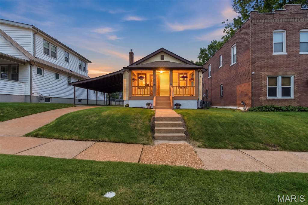 Tucked into the heart of sought-after Lindenwood Park, this beautifully renovated and meticulously maintained bungalow blends timeless charm with thoughtful updates on an oversized lot that’s hard to find in the city. Just moments from neighborhood favorites, parks, restaurants, coffee shops, local shopping, the Great Rivers Greenway Trail, and convenient Metrolink access, the location offers the perfect mix of city convenience and neighborhood charm. Inside, you’ll find refinished hardwood floors, original stained glass windows, fresh paint throughout, and a bright, welcoming feel from the moment you walk in. The updated kitchen features granite countertops, stainless steel appliances, and easy access to the enclosed rear sitting porch — the perfect place to unwind while overlooking the backyard oasis. Step outside and enjoy a backyard designed for relaxing and entertaining, complete with an above-ground saltwater pool, patio area, expansive yard space, and room to host all summer long. Whether it’s quiet mornings outside or gatherings with friends and family, this outdoor setup is something special. The renovated bath, updated electric and plumbing, and clean, dry walkout basement add peace of mind and flexibility, with the lower level offering excellent potential for additional living space, a home gym, office, or rec room. An oversized carport easily fits two vehicles in addition to the detached one car garage. Homes with this level of care, character, updates, outdoor space, and unbeatable location rarely come along in Lindenwood Park.