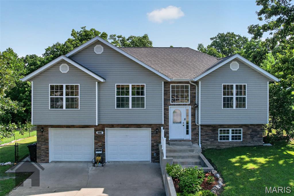 Welcome home to this charming 4-bedroom, 3-bath split-level nestled in a quiet neighborhood just off Historic Route 66, offering quick access to everything the area has to offer. Inside, you'll find an open-concept living, dining, and kitchen area featuring newer luxury vinyl plank flooring, stainless steel appliances, and a breakfast bar perfect for gathering with family and friends. The upper level includes a spacious primary suite with a walk-in closet, double vanity, and tiled jetted tub/shower, along with two additional bedrooms and a full bath.
The finished lower level offers a cozy family room, fourth bedroom, full bath, laundry area, and extra storage, providing flexible space to fit your needs.
Enjoy added peace of mind with fiber optic internet, a newer HVAC system, and a newer water heater. Outside, the spacious rebuilt deck is ready for entertaining or relaxing after a long day. This home combines comfort, convenience, and thoughtful updates in a fantastic location. Schedule your private showing today!