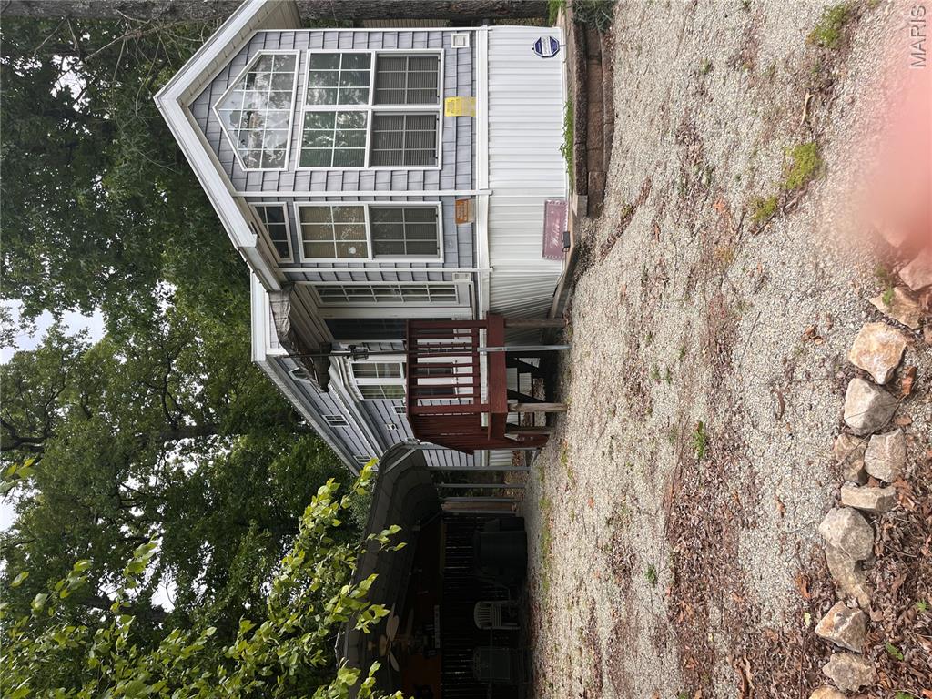 Escape to lake life with this charming fully furnished tiny home tucked inside the desirable Goose Creek Lake community! Situated on a level lot just moments from the beach, boat ramp, pool, rec hall, playground, and snack bar, this cozy retreat is the perfect weekend getaway, vacation property, or low-maintenance full-time residence. Inside you’ll find an open-concept living space with 1 bedroom, 1 full bath, 2 half bedrooms located upstairs, air, electric forced-air heat, and a comfortable layout designed to maximize every square foot. All furnishings stay, making this property move-in ready so you can start enjoying lake living immediately. Outside features include a covered 2-car carport, storage shed, gravel drive, and easy access to all community amenities. Property is serviced by shared well and shared septic systems. Affordable, easy to maintain, and packed with recreational opportunities — this Goose Creek gem is ready for summer fun, fishing weekends, or peaceful country living near the lake! Also, the neighboring twin property is also available for purchase, offering a unique opportunity for additional space, expanded use, or potential investment property used as a rental property. The possibilities are endless!