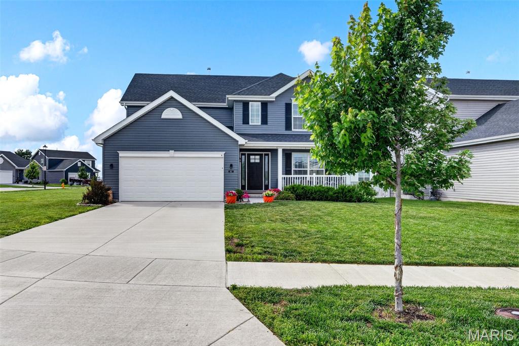 Skip the build time and move right into this pristine, like-new 4BR/2.5BA two-story home in the highly desirable New Town / Charlestowne Landing area of St. Charles! Built in late 2023, this McBride Royal II model offers a thoughtfully designed living space, providing the flawless feel and modern energy efficiency of new construction without the wait or design-center stress.  The open-concept main level is flooded with natural light from 6ft windows and features durable wood-style flooring, a dedicated formal dining room, a powder room, and a spacious family room. The chef-ready kitchen is equipped with a massive center island, a breakfast bar, white 42” cabinetry, a walk-in pantry, and stainless steel GE appliances—and yes, all appliances are included! Step through the breakfast room's sliding glass doors into your private outdoor oasis, featuring a patio and a fully fenced backyard that is perfect for entertaining, pets, or relaxing evenings.  Upstairs, unwind in the massive primary suite complete with a walk-in closet and a luxury en-suite bathroom featuring a double bowl vanity, soaking tub, and separate walk-in shower. Three additional generous bedrooms and a full hall bath round out the upper level. Need even more space? The deep-pour 8ft+ unfinished basement with an egress window and bath rough-in offers massive storage or stands ready for your future finishing touches.  Beyond the property line, this home offers incredible location highlights and community growth. The top-rated Orchard Farm primary and high schools are only minutes away, making daily commutes simple and convenient. Furthermore, a brand-new park is currently being built nearby to add future walkable green space and recreation just steps from your door. Best of all, a new Dierbergs full-service grocery store is under development near Highway 370 and New Town Blvd, bringing premier shopping and dining right to the neighborhood.  As an added bonus, the existing furniture may be available for purchase separately, offering a seamless, turn-key transition option for relocating buyers. This move-in-ready gem perfectly combines modern interior finishes, highly desirable outdoor space, and exciting neighborhood growth. Schedule your showing today!