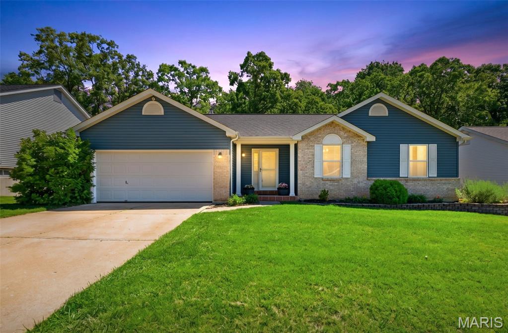 You must see this adorable MOVE-IN READY 3 bedroom, 2 bath ranch with 2 car garage! The vaulted great room has a beautiful wood burning fireplace with custom mantle. It opens to the breakfast room (with a bay walkout to large deck) and then to a spacious kitchen with freshly painted cabinets and brand-new SS appliances. The large primary bedroom has a vaulted ceiling and bay window plus its own private bath & walk in closet with updated shelving! Two other nice size bedrooms & 2nd full bath complete the main level! The finished walkout lower level features a family room with dry bar and electric fireplace, a large rec room, the laundry room plus lots of storage! Outside, enjoy the backyard space complete with a large deck overlooking a fenced, wooded, level backyard, and large patio with tons of PRIVACY!  MAJOR UPDATES providing peace of mind are:  SS kitchen appliances (2026), main level carpeting (2026), backyard retaining walls (2026), new stairs and railings on deck (2026), roof, siding, gutters, soffits and facia (2024), 6’ wooden privacy fence and retaining wall behind the fence (2023) and complete HVAC (2020)! This beauty is located just minutes from I70 or Hwy K! You’ll love EASY ACCESS to shopping, dining, and everyday amenities. This one has so much to love! IT CAN BE YOURS!