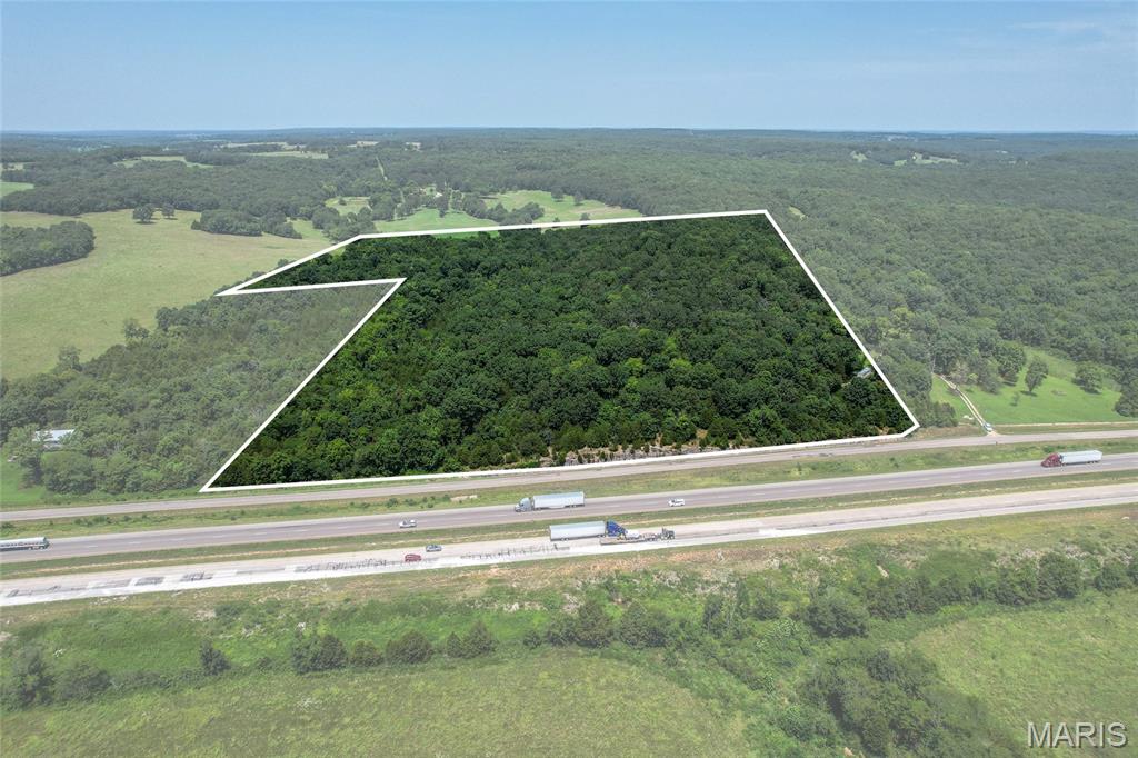 29 ACRES with I-44 Frontage in Laclede County! This land is located near the Sleeper exit ( Exit 135) and has more than 800 ft of Interstate 44 frontage.  This 29.19 acre wooded retreat in the Stoutland School district offers a rare blend of accessibility and possibility! Nearly 2 miles of interstate visibility along Garden Crest Road, the location is just 10-15 minutes from Lebanon, and within an hour of both Springfield and Rolla.  A path from the front of the property to the back reveals multiple beautiful potential building sites shaded by mature oak timber. Nearby electric is available at the Southeast corner. Whether you're dreaming of a homestead, a weekend hunting retreat, or building your dream home this fully wooded parcel gives you room to roam and the privacy to make it your own.  A 40 foot shipping container is also included which is great for storage or a job site start. Whether you're envisioning a future home, a hunting camp, or simply land to call your own this property offers the timber, terrain and location to bring that vision to life. Interstate access makes commuting or hauling equipment simple, while the wooded acreage keeps you tucked away from it all.  Land like this with frontage, timber, and utility access nearby doesn't come along often! Call today!