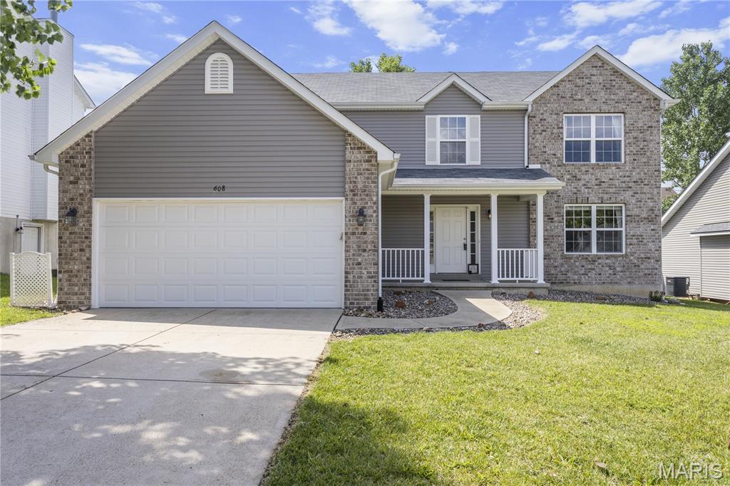 Beautiful Hillsboro 2-story with brick accents and covered front porch is ready for its next owner!  With 2500sf and a 1/3rd acre yard, this home has so much room to spread out.  The interior boasts 9' first floor ceilings and enjoys an open floorplan, perfect for entertaining!  The great room includes a wood-burning fireplace and connects seamlessly to the breakfast room with bay window, and kitchen which features 42" maple cabinets with crown molding, walk-in pantry, recessed lighting, stainless appliances, backsplash, built-in microwave and a two year old dishwasher.  Rounding out the main level are wood floors, living/flex room, powder room and laundry.  The upper level showcases three secondary bedrooms, hall bath, loft, and a huge primary bedroom with walk-in closet & ensuite with dual adult height vanities, jetted tub and walk-in shower.  Completing this beauty is a 3 car tandem garage, and the huge mostly flat, mostly fenced backyard with paver patio and gazebo!
