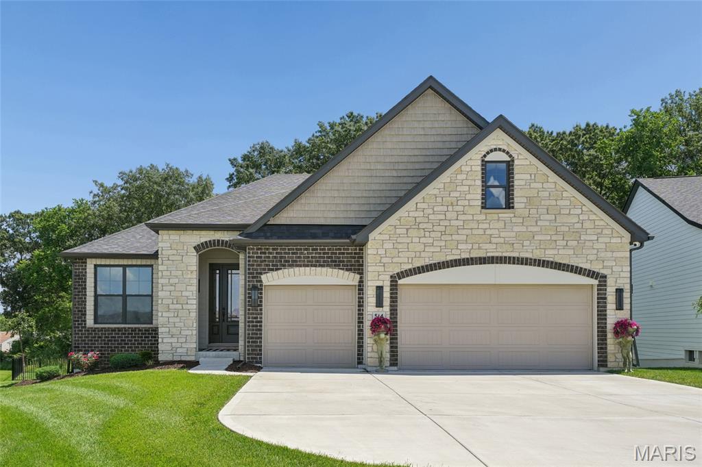 Welcome to this stunning 3 bedroom,2 bathroom ranch style home, where modern luxury meets tranquil living. Constructed just 3 years ago, this meticulously maintained home is perfectly positioned on a premium lot offering peaceful lake views. 
The home's striking curb appeal begins with a beautifully appointed stone and brick facade. An open, light-filled layout is enhanced by 9 and 11 ft. ceilings.

The heart of the home is the beautifully designed chefs kitchen, featuring an 11 ft. stone arch, sleek quartz surfaces, a double oven, pot filler and micro drawer. 

The living spaces flow seamlessly, blending style, function and refined design. The current owner has created a standout feature in the great room- a true showcase for wine enthusiasts.

Retreat to the primary suite, complete with a  custom walk in closet and a spa-like bath. The en-suite bath boasts a spacious marble walled shower.   The secondary bedrooms are also generously proportioned.

The lower level offers  an outstanding opportunity for expanded living space.  A full 9 foot pour, brick textured walls, an egress window, along with stubbing for a bath and wet bar readies this space  for your future customization.

Step outside to your private oasis. A large deck overlooks the lake and a fully fenced backyard provides privacy and flexibility for relaxing, entertaining or pets.

This exceptional property combines nearly new construction, high-end customs finishes and a premium lake view setting- an opportunity you won't want to miss. Home Warranty Included!