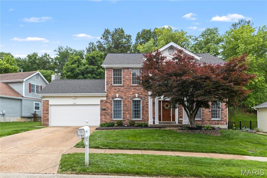 STATELY Two-Story Center-Hall Colonial with 4 Bedrooms and 3 and a Half Baths in Wildwood. Located in the highly desirable Timber Ridge Estates subdivision, this spacious Home has over 3100 square feet of living area. The main floor features a grand two-story entryway flanked by formal living and dining rooms. The Eat-In Kitchen has lots of cabinet space with a center island and breakfast room, and is open to the large Family Room with a gas Fireplace. A main floor Laundry and Half Bath complete the first floor. Upstairs are the 4 Bedrooms and 2 full bathrooms including the Vaulted Primary Suite with walk-in closet and attached bath with separate tub and shower. The lower level features an additional 600+ square feet of finished space, a 3rd Full Bathroom, and plenty of storage. Private backyard with paver patio backs to woods. Quarter acre plus Lot. 2 car attached garage. NEW ROOF 2019. Subdivision Pool is located just 8 doors down. Rockwood Schools.