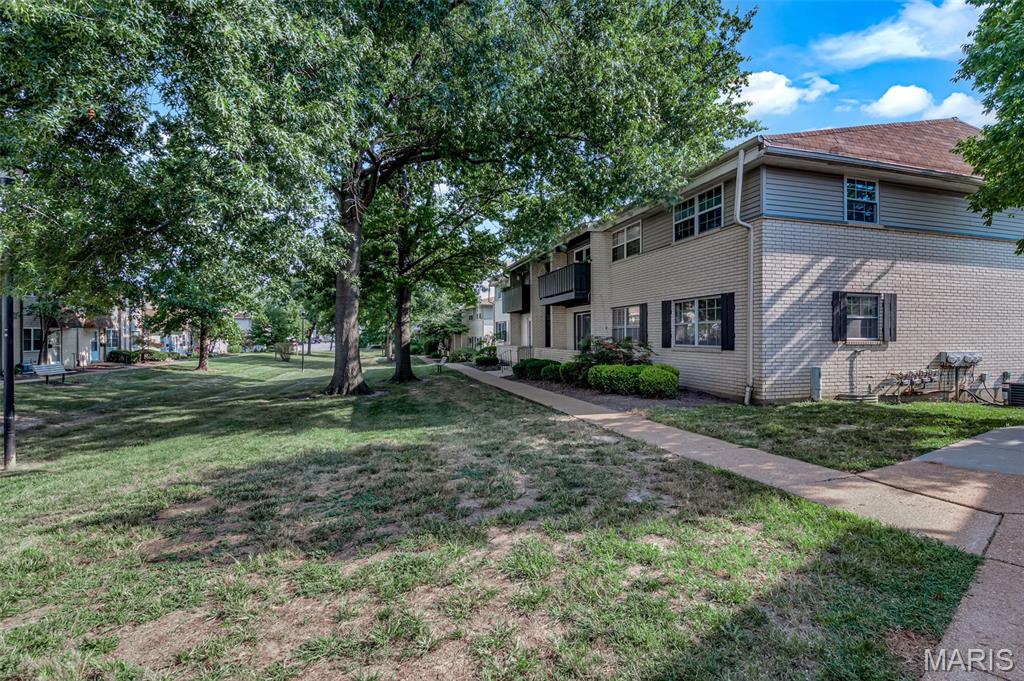 NEW WINDOWS JUST INSTALLED | For Owners ONLY - Cannot be rented.
Excellent Ballwin Location | Top Notch Rockwood Schools | Affordable open concept living | Heart of shopping and restaurants. Welcome | Neighborhood Pool | Kids Play-yard | Park like central courtyard | Mature trees | Garage parking + Reserved parking lot spot | Electric Panel upgrade 2024 | New dishwasher | 2025 - New Carpet, New Paint, New Countertop, Bathroom remodel, New clothes washer

Welcome to this cozy low maintenance apartment style condo with 2 bedrooms and 1.5 bath with almost 900 sq. ft. of living space. Upon entering you see living room to the right that also leads to the patio with sliding glass door. The other side is the dining area with tiled floors. Kitchen has white cabinets, new SS dishwasher, gas cooktop, new white countertop. Hallway leads to the half bath, master bedroom with its own bath and additional bedroom. 

There is a garage spot and also a reserved parking lot space. Washer & dryer and additional storage are in the basement
