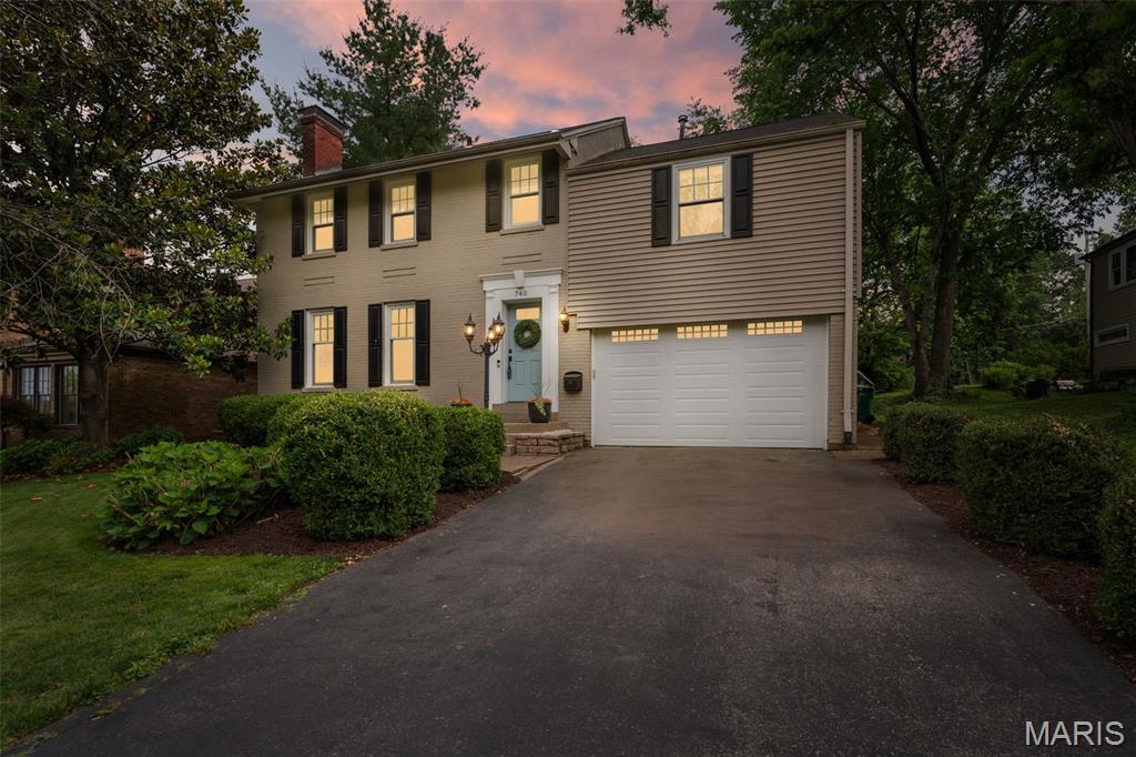 Tucked away on a private street in one of Webster Groves’ most loved neighborhoods, 740 Fieldston Terrace is the kind of home that immediately feels welcoming the moment you arrive. Inside, timeless character and everyday functionality come together beautifully. Original wood floors, a stunning fireplace, charming built-ins, and a classic colonial layout provide all the warmth and character buyers are searching for, while the updated kitchen and thoughtful spaces throughout make daily living easy. Details like the built-in banquette and sun porch create those inviting spaces that quickly become favorite spots in the home. Upstairs offers spacious bedrooms, a charming second-floor sun porch, and two gorgeously updated bathrooms that blend modern style with classic appeal. The lower level adds valuable flexible living space perfect for whatever your needs may be. Outside, the backyard feels like an extension of the home, with a great lot and outdoor living space complete with a pergola that stays — ready for relaxing evenings or entertaining friends. The oversized 1.5+ car garage can easily fit a golf cart and car. The location is just as special, with a private path at the end of the block connecting to Edgar Road (Elementary, Pool, Fireworks Celebration, Blackburn Park and even Old Orchard Shopping and Dining) and easy access to I-44 and Watson Road, making it simple to get anywhere in the county or city. This is the kind of Webster home buyers wait for — full of charm, thoughtfully updated, and truly the total package.