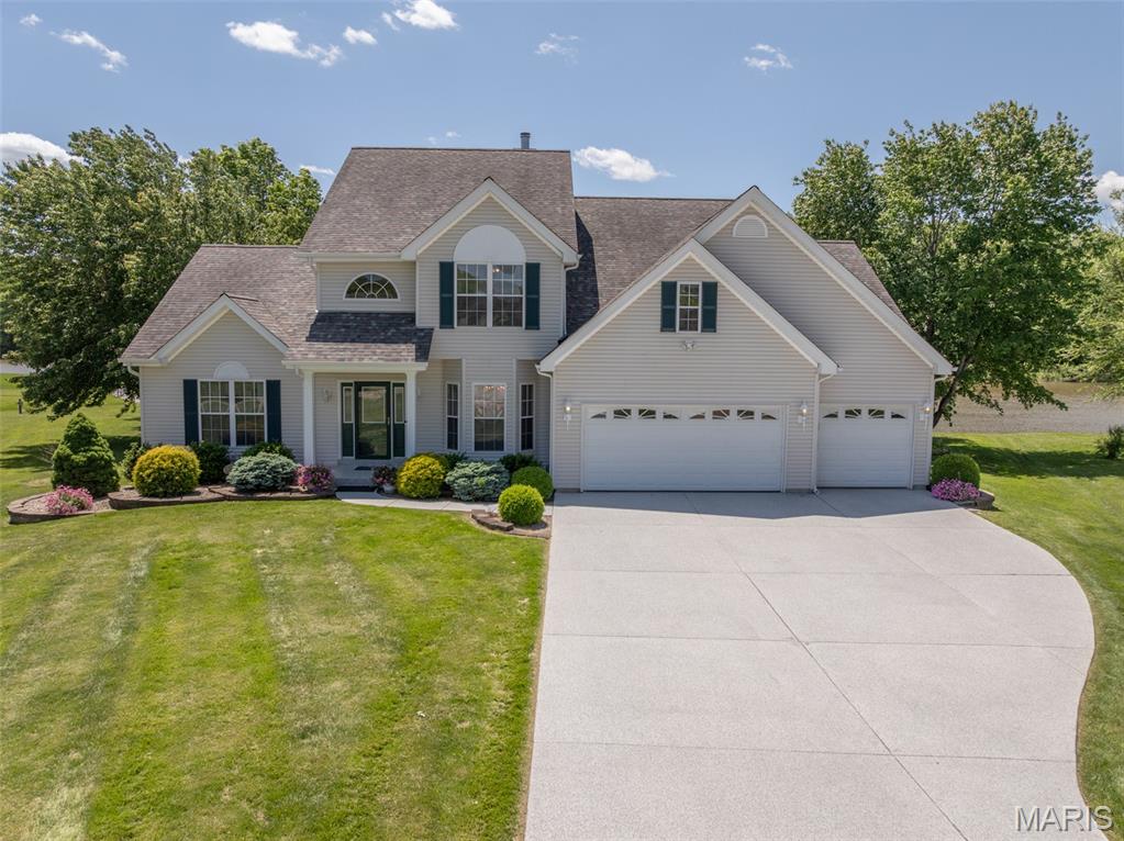 Coming soon Friday May 15. WATERFRONT home on the calm no-wake end of the big lake at Incline Village! This is one of the largest homes on the water on one of the biggest lots, sporting 165 feet of waterfront on over a 1/3 acre lot.  The secret is out Incline Village is the place to be - Lake Life and only 15 minutes from Wentzville! The popularity of Incline Village has grown tremendously in the last 5 years, now is your chance to own a waterfront home with a dock. You will be able to boat, fish, paddleboard, or kayak from your waterfront backyard! And we have to mention the SUNSETS - amazing sunsets are the perfect way to wind down your day. This sizeable home is patiently awaiting a new family to love it. It has 4 spacious bedrooms and the possibility of more - an enormous flex room on the main level has been used as a home office but could be made into a generous lake bunkhouse with room for sleep and play or it could be a great area for homeschool with an entrance to the low-maintenance deck. There is so much to love - the main floor primary suite with a vaulted beamed ceiling offers a great retreat for owners with a luxury bath with lake views and a sizeable walk-in closet. 18 foot ceilings and a wall of windows welcome guests into the main entertaining area that then flows to the breakfast/kitchen area with ample cabinets, island breakfast bar and a double fireplace between. Just off this area is a big 4-season room with independent heat and cool, giving you someplace to enjoy your lakeview year-round. Also on the main floor is a formal dining that could be a sitting room or home office with the change of a light fixture. There is also an efficient main floor laundry with cabinets & a sink located near the garage. Upstairs is great for kids or guests with a nice size loft complete with a library area with bookshelves, 3 bedrooms and an updated bath with a large shower. Over 4400 square feet to enjoy with dual heat and air systems, a giant 3-car garage, private boat dock and a big flat yard that walks out to the water. What are you waiting for? This one has room for everyone and waterfronts are rare especially on the no-wake end! People love Incline as a full time residence or for week-end fun with several lakes, a clubhouse & party pavilions available to rent, community pool, pickleball, swimming beach and a public golf course. Plus the activities like Band on the Beach events in the summer, the spectacular 4th of July Fireworks Display, golf cart parades, water aerobics, winter bingo, paint & sip events, fishing tournaments and this year a Cardboard Boat Regatta - it is not just a subdivision with beautiful lakes & golf it is a Lifestyle - make it what you want!